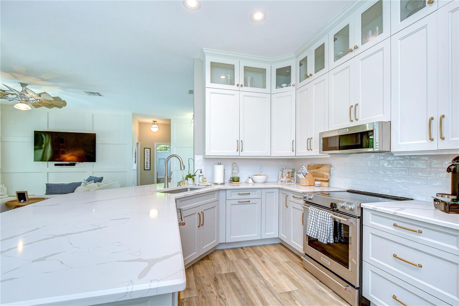 Ceiling-height cabinetry with crown molding and display cabinets.