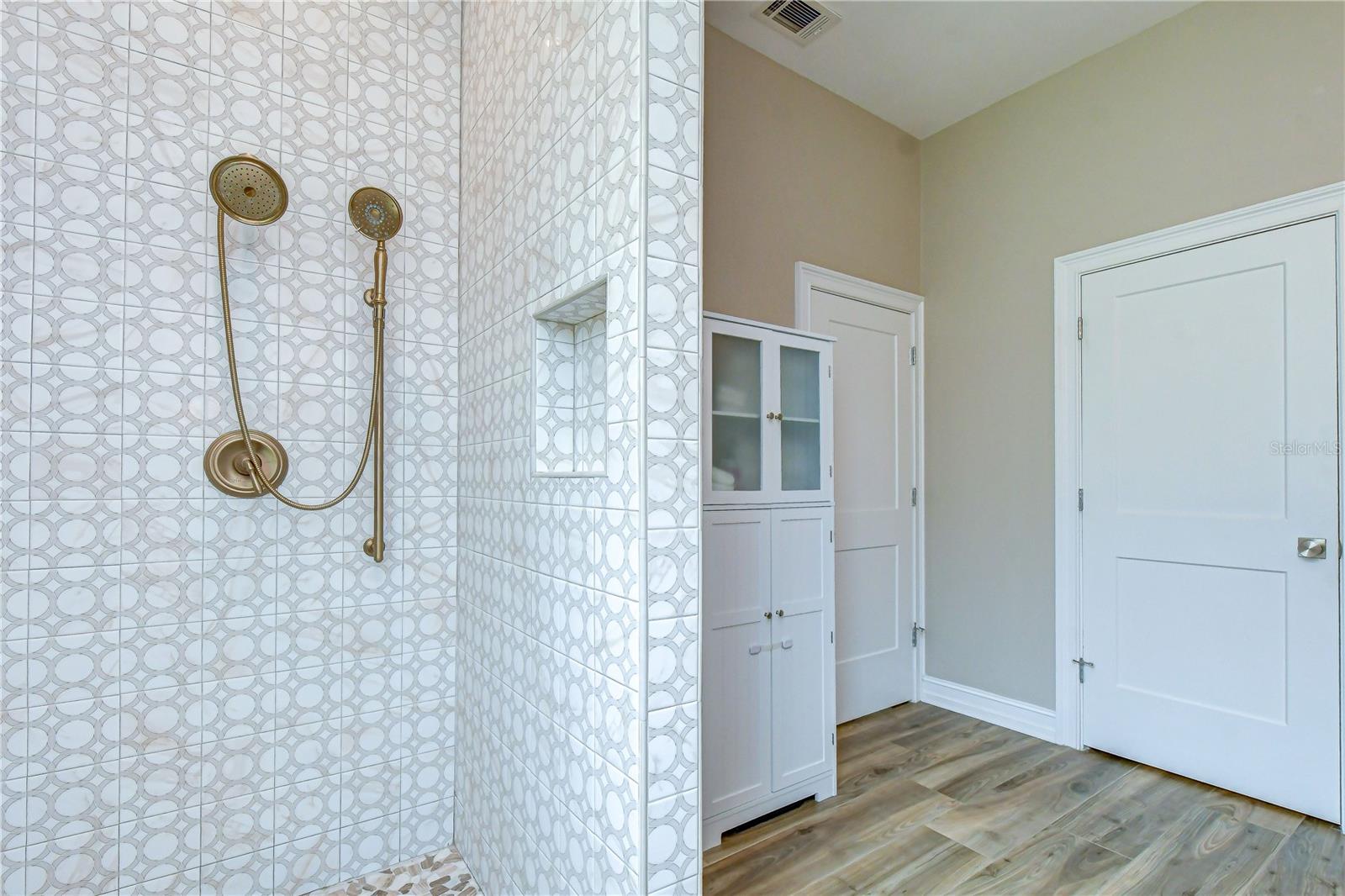 Custom oversized shower with designer finishes.