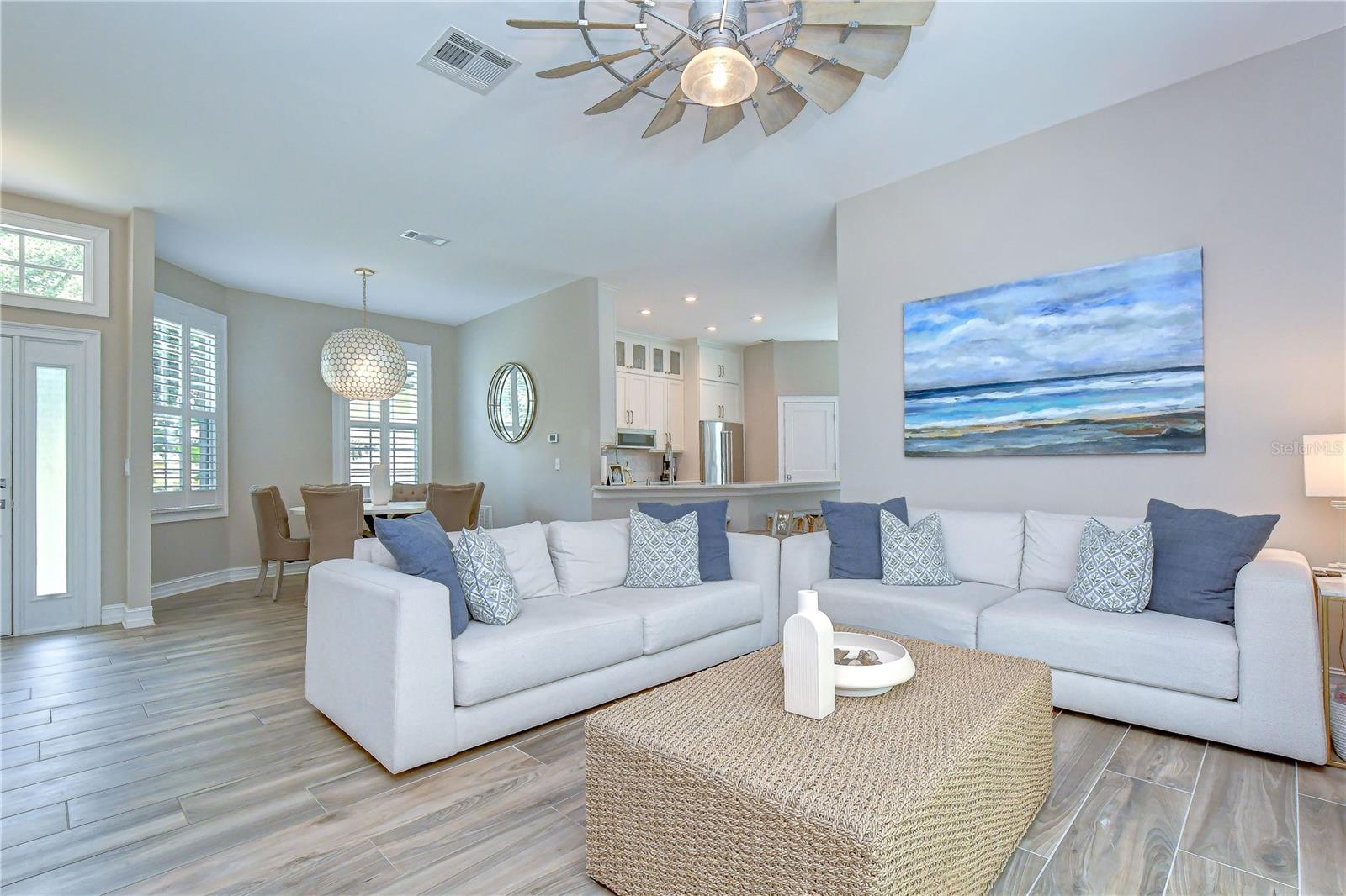 Spacious open-concept living area filled with natural light.