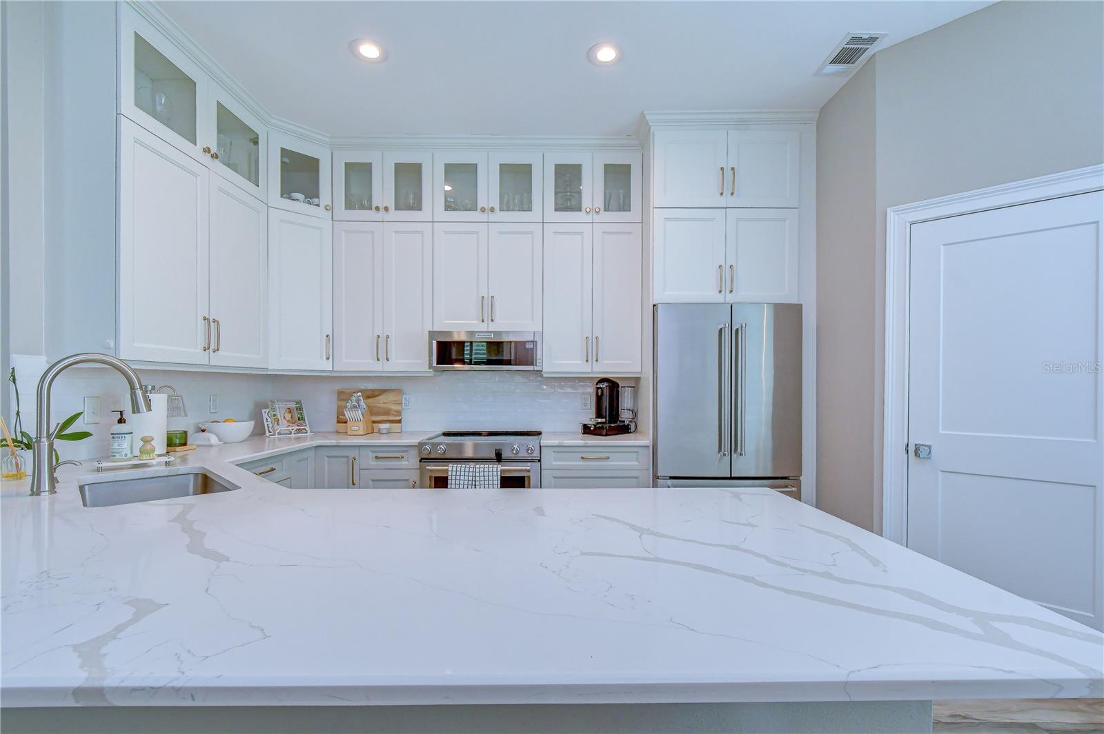 Elegant quartz countertops with generous workspace.
