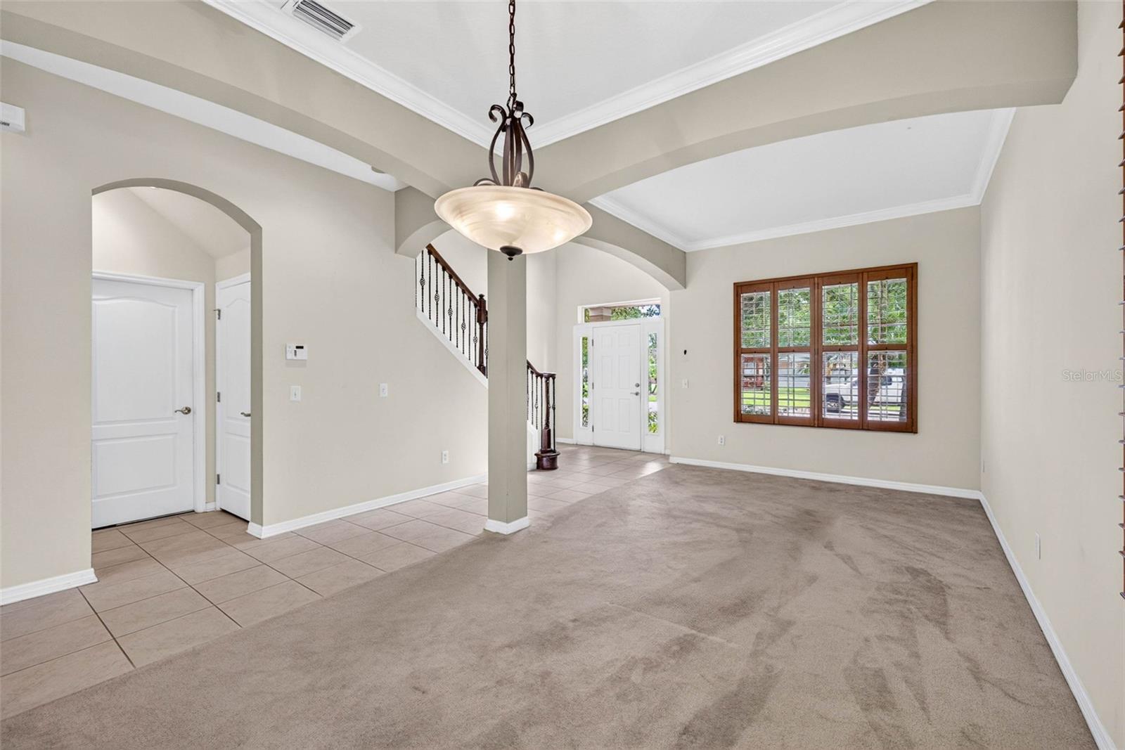 Formal dinging and living areas with plantation shutters