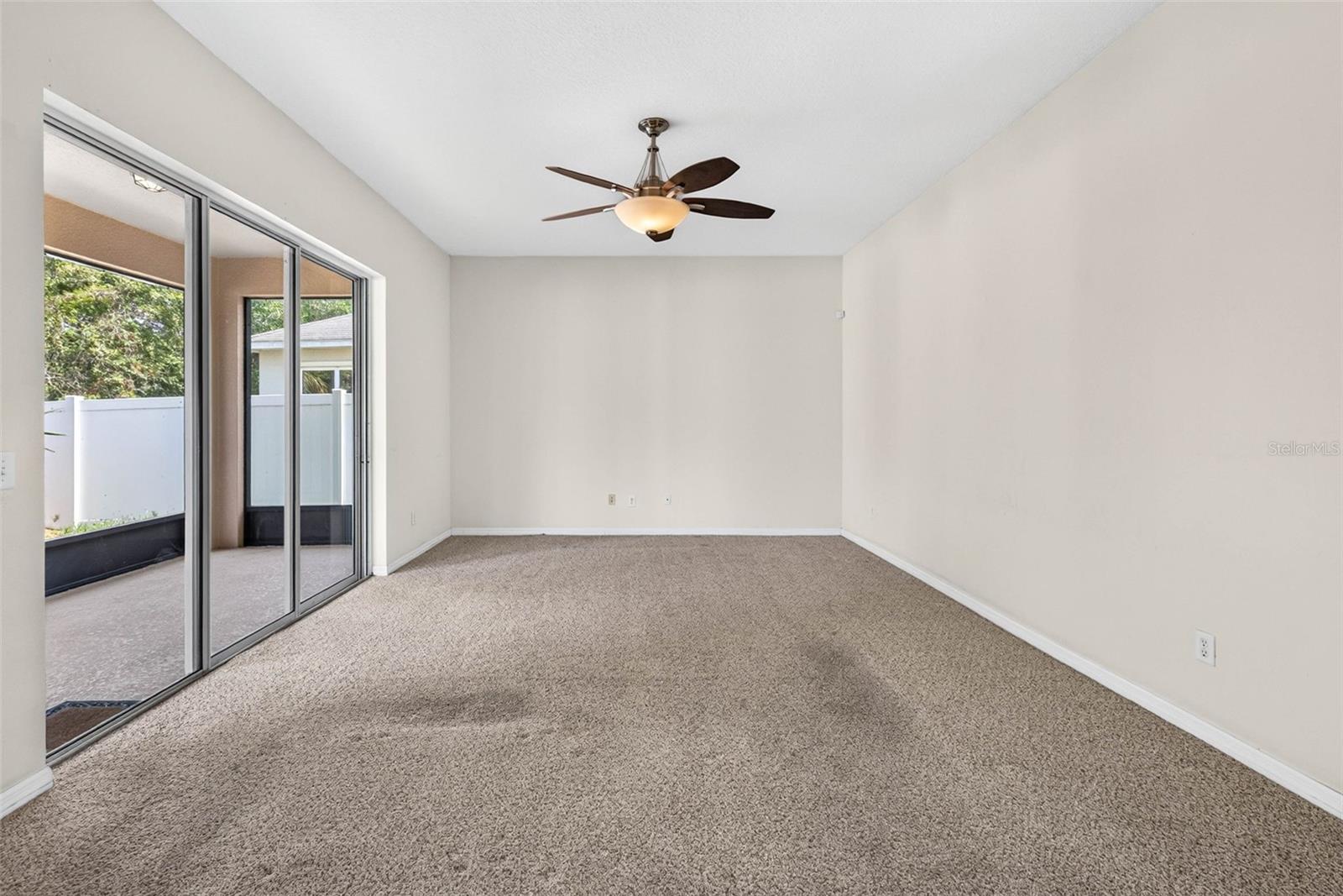 Family room with sliding doors to covered lanai.