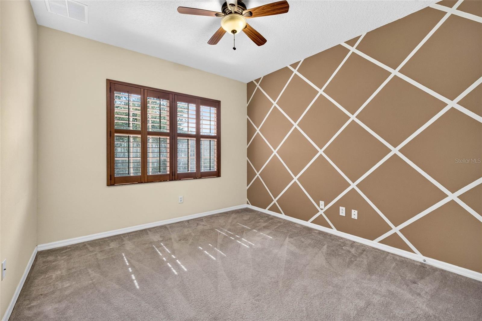 Secondary bedroom with plantation shutters