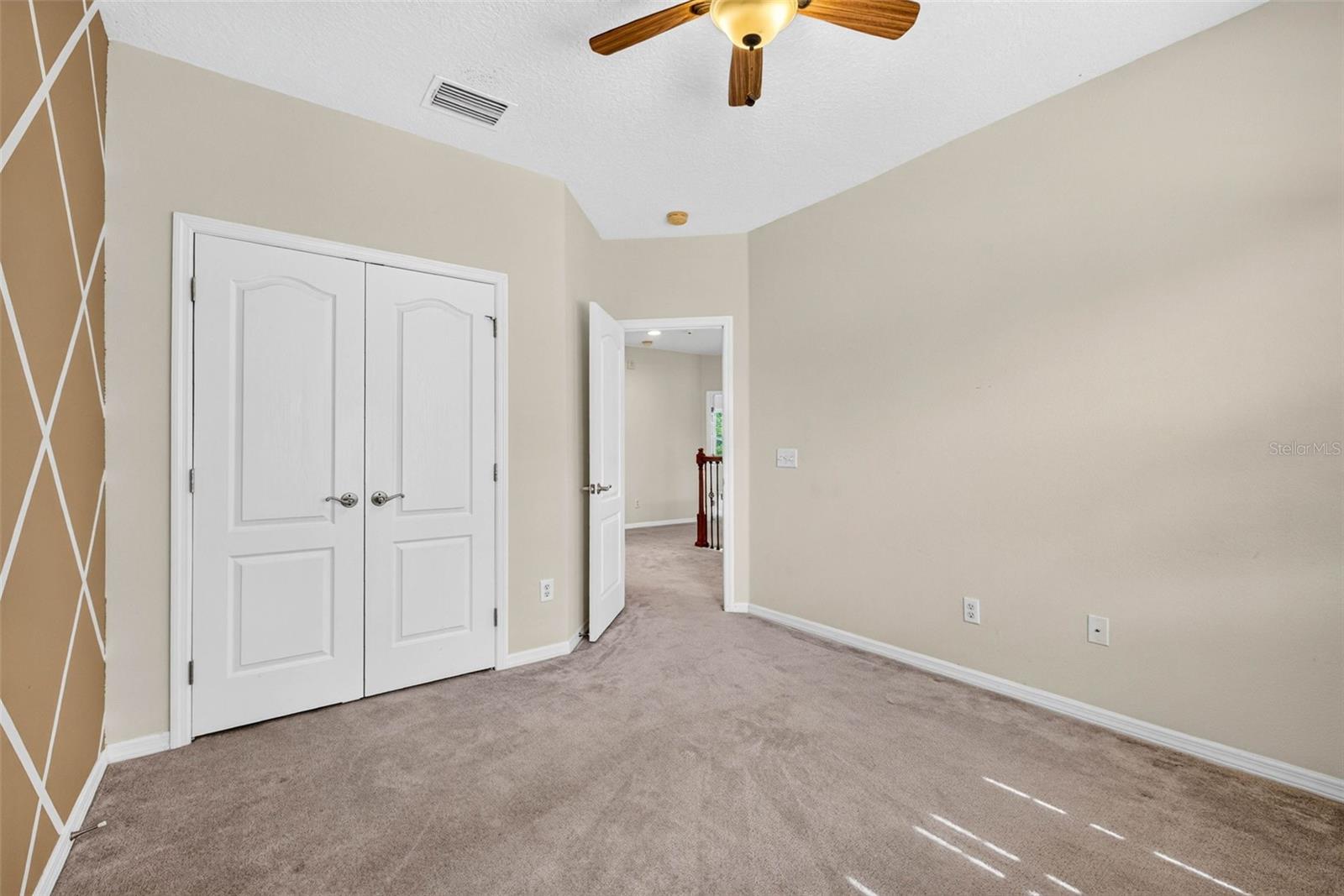 Secondary bedroom with french door closet