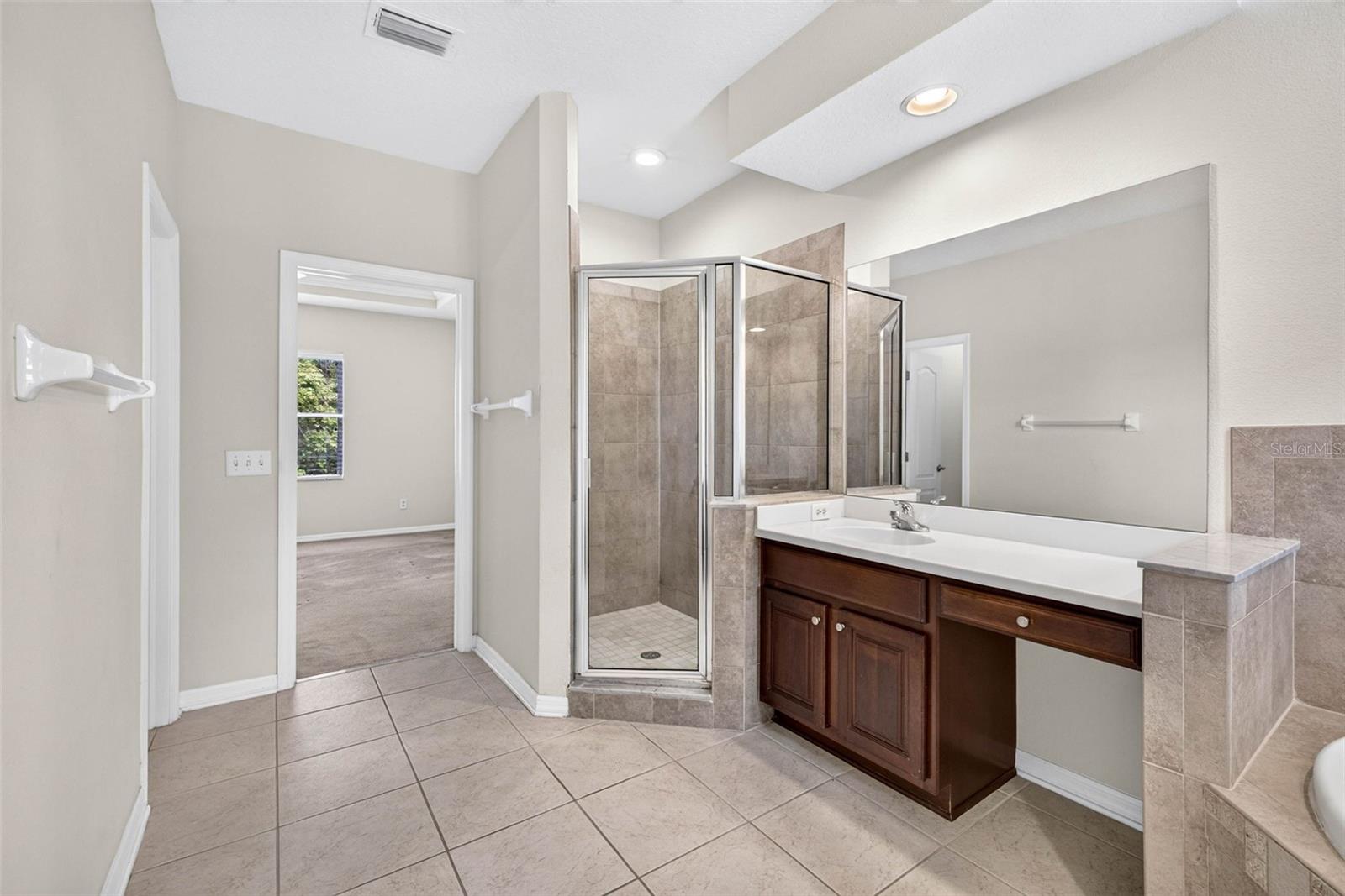Primary bathroom with private wash closet and split vanities