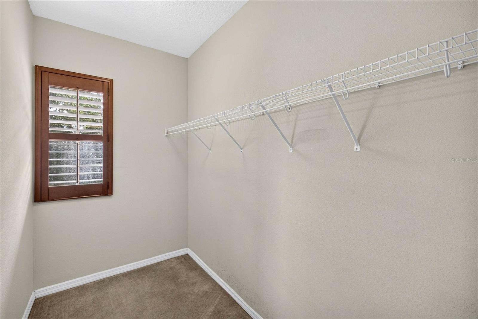 LARGE primary closet located off of primary bathroom