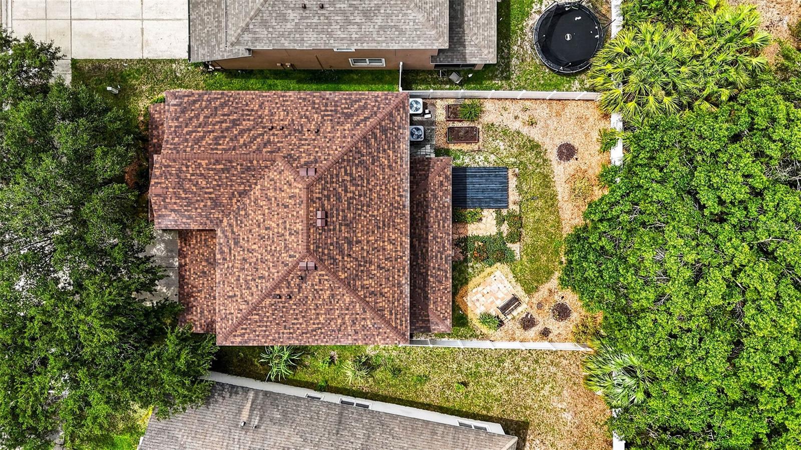 Aerial shot of yard and conservation area behind the house.