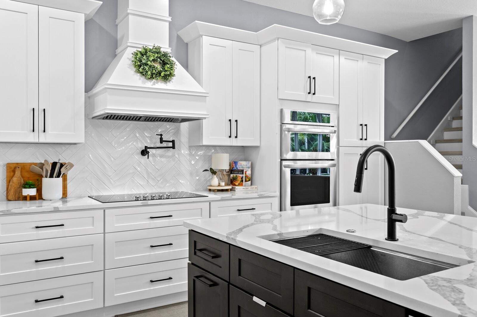 Custom vent hood and plenty of drawer storage