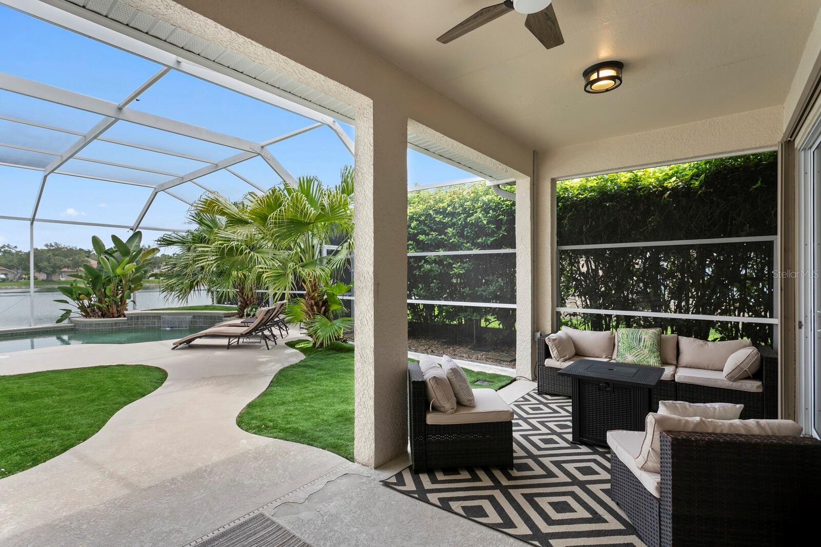Pool & pond views form the covered lanai