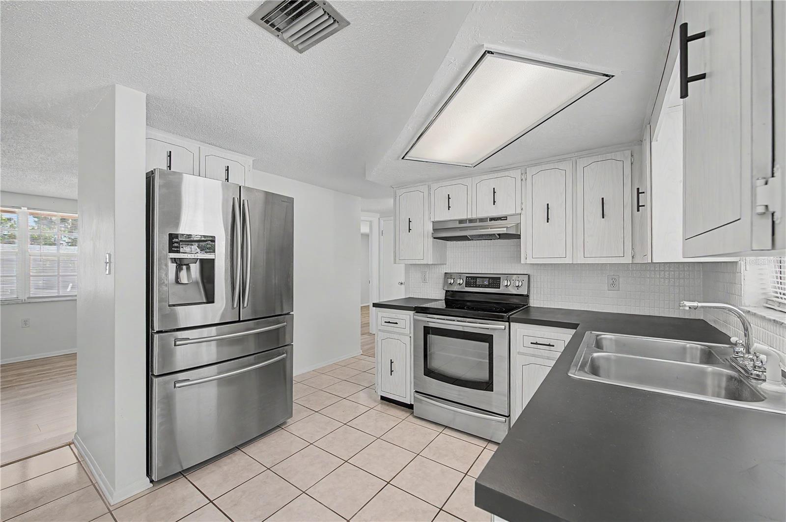 Kitchen with NEW Stainless Steel Appliances - 9830 Rainbow Lane
