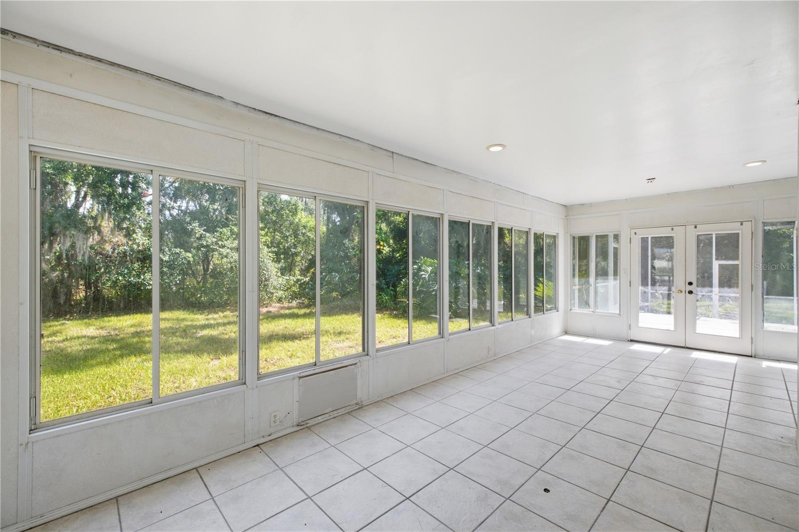 Florida room view to wooded trees