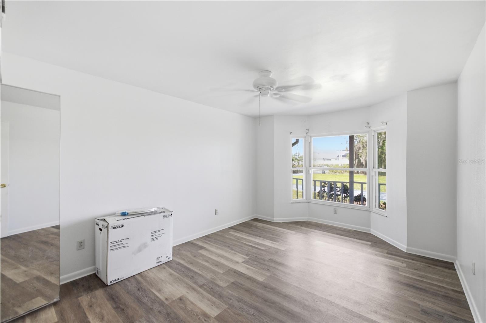 Downstairs bedroom looking to front of property