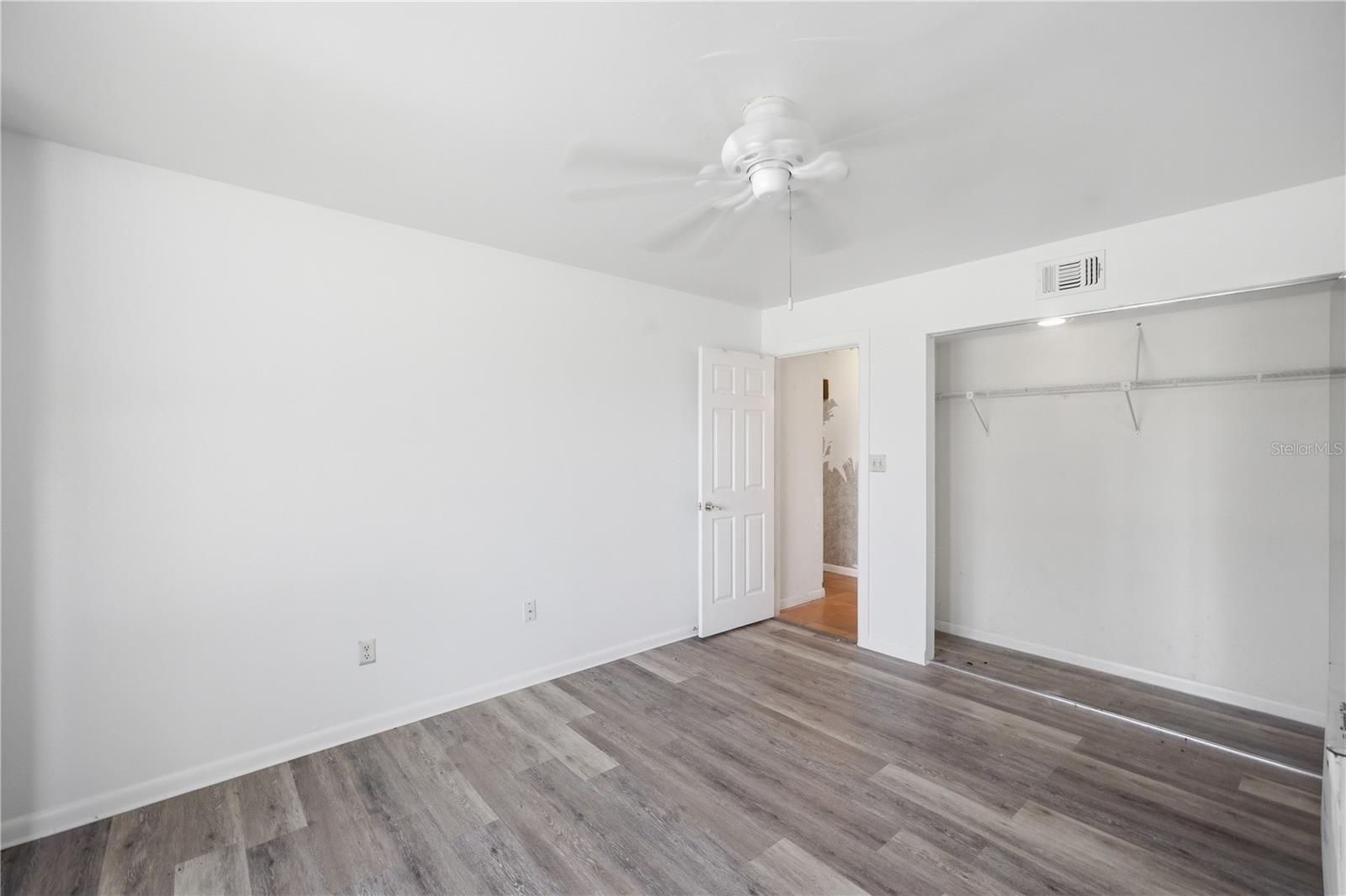 Downstairs bedroom looking to front of property