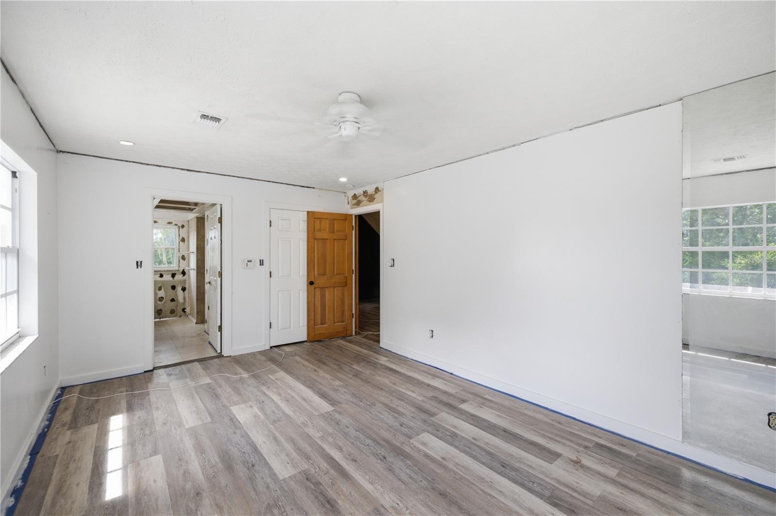 Master bedroom with closet behind entry door