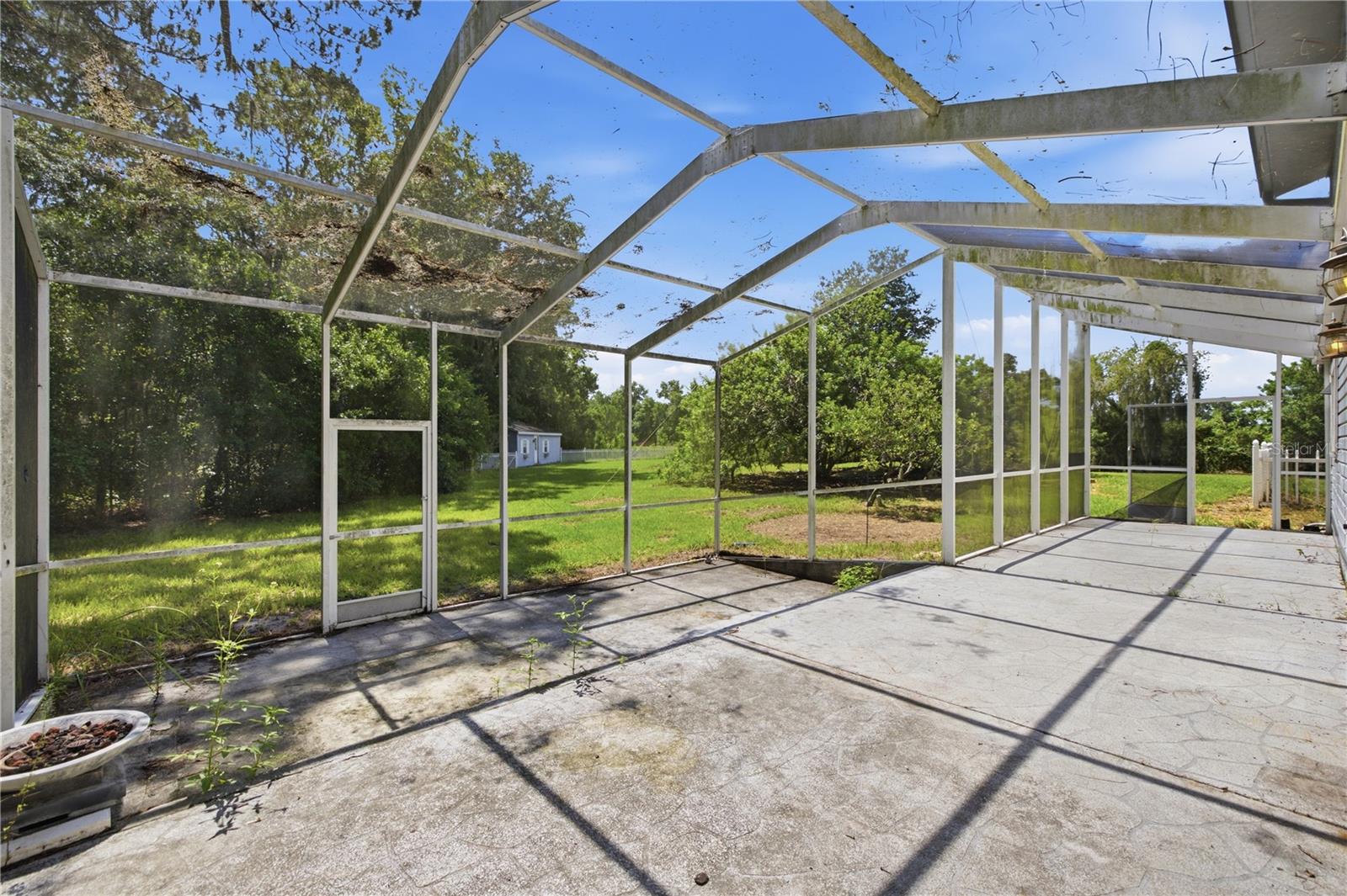 Screened-in concrete patio