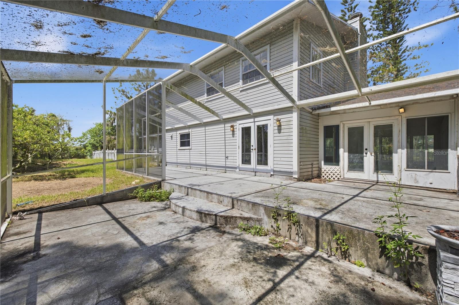Screened-in concrete patio