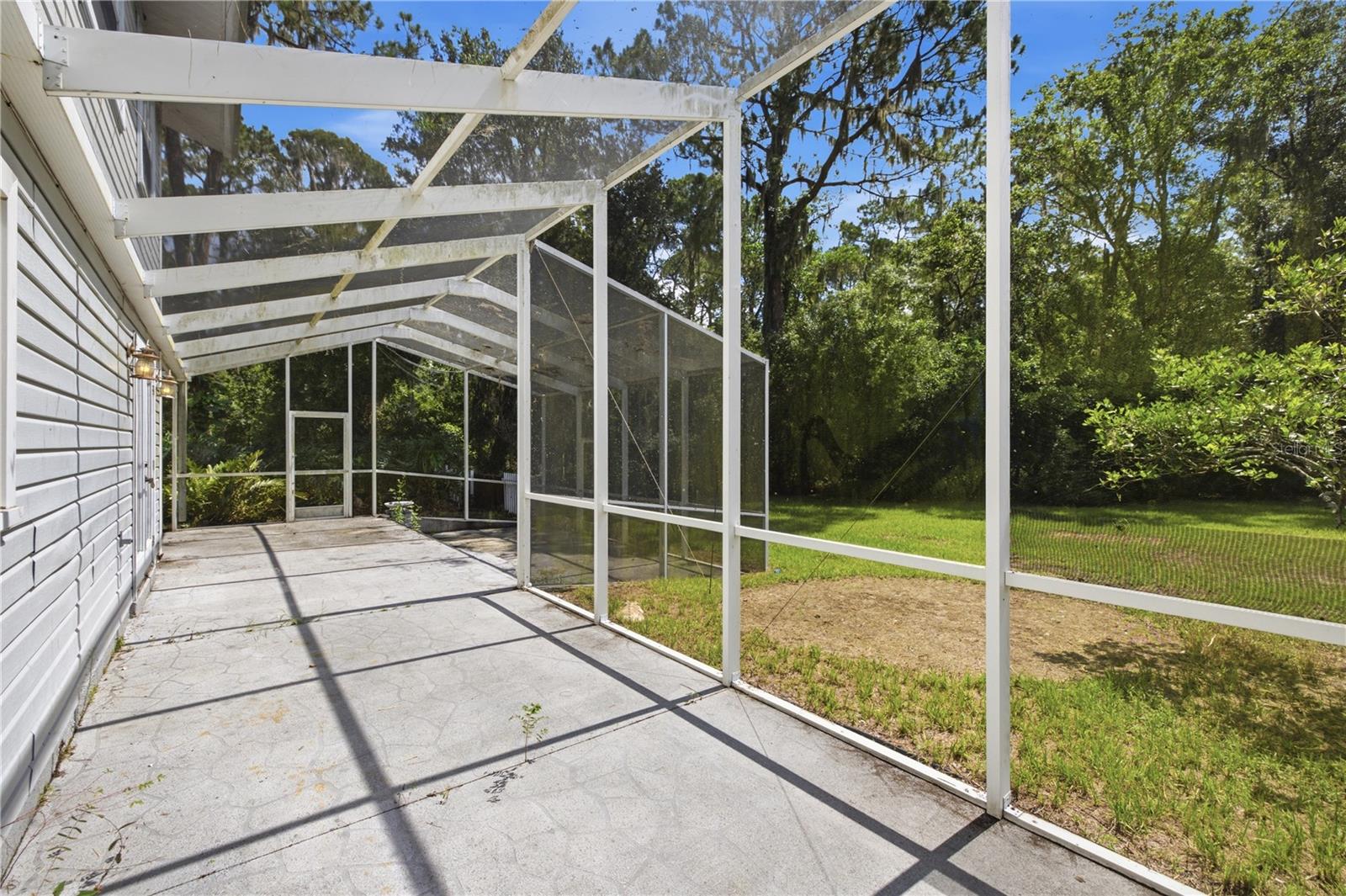 Screened-in concrete patio
