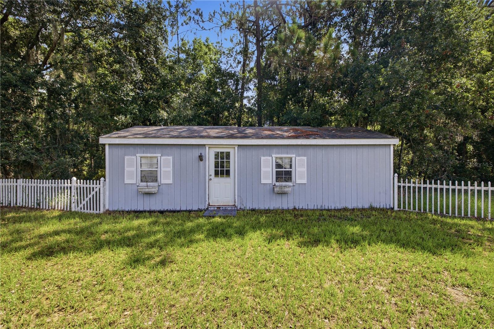 Storage shed with electricity available, windows located in the rear