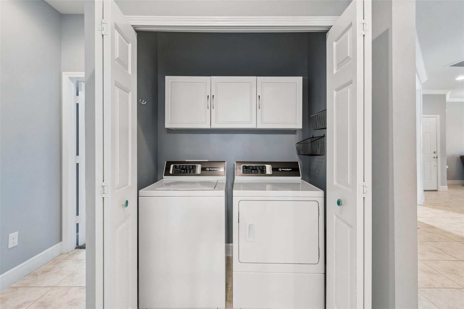 LAUNDRY CLOSET WITH STORAGE CABINETS