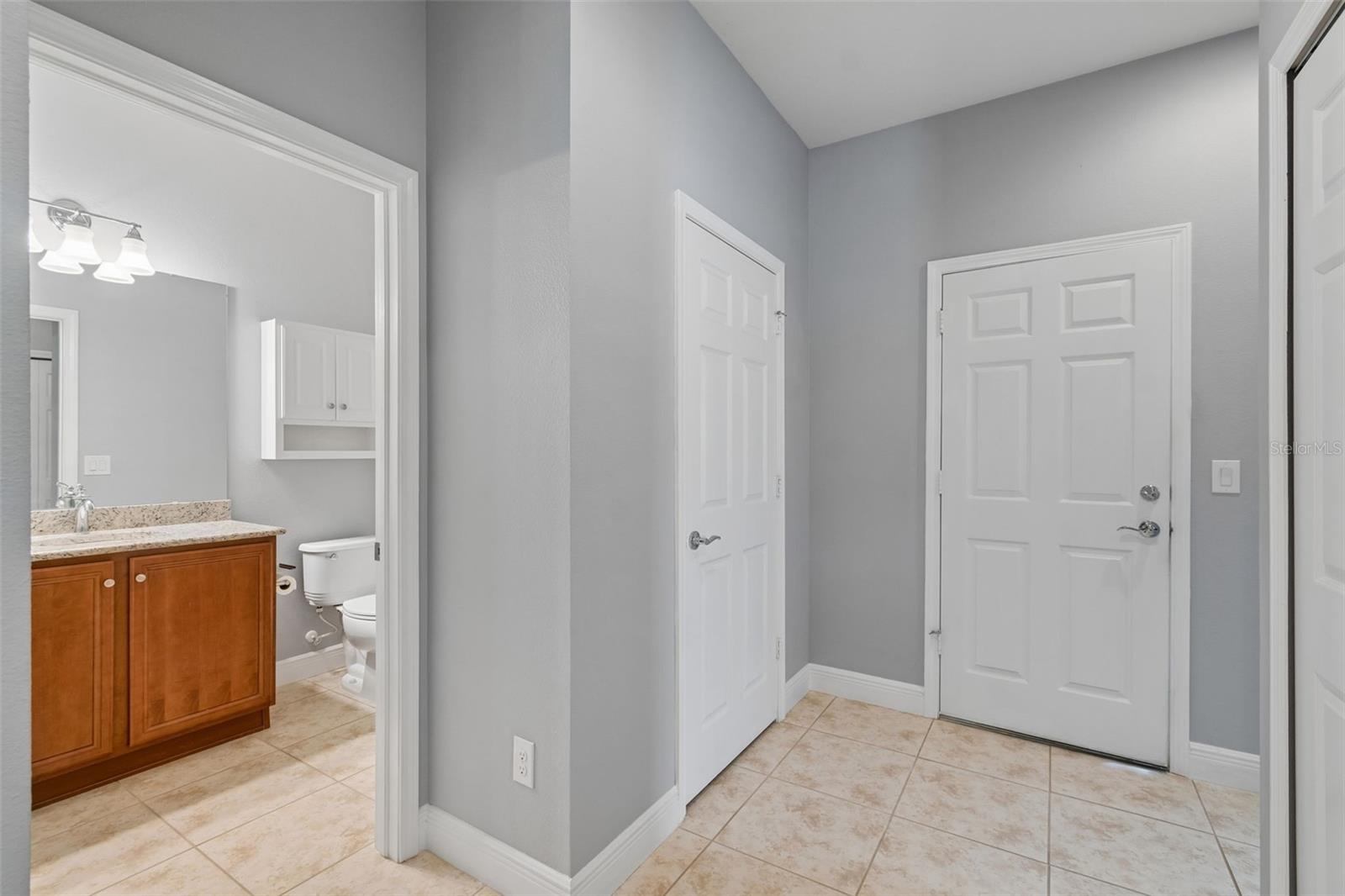 HALL CLOSET/DOOR TO GARAGE