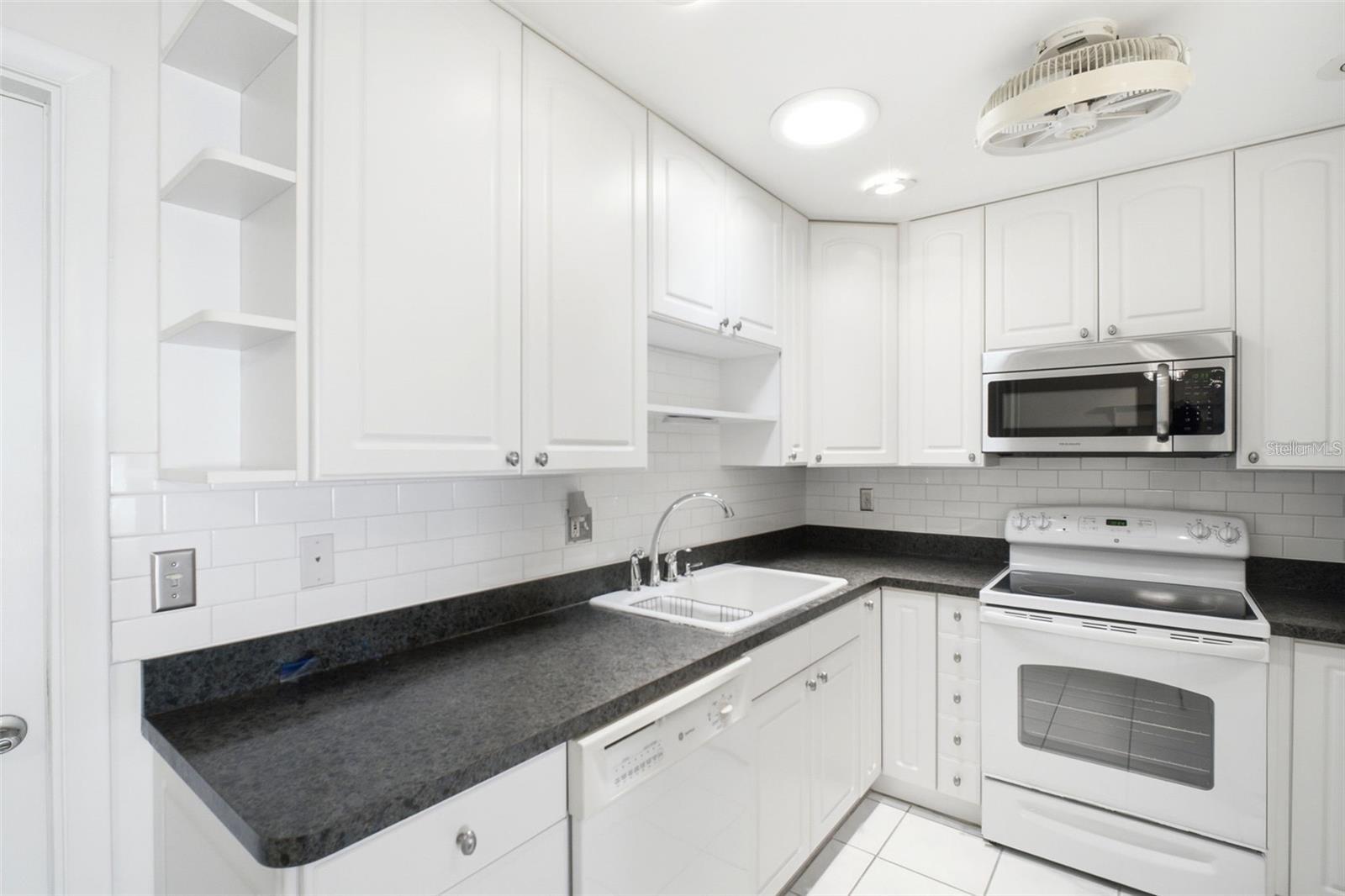 Updated deep sink and beautiful subway tile backsplash~