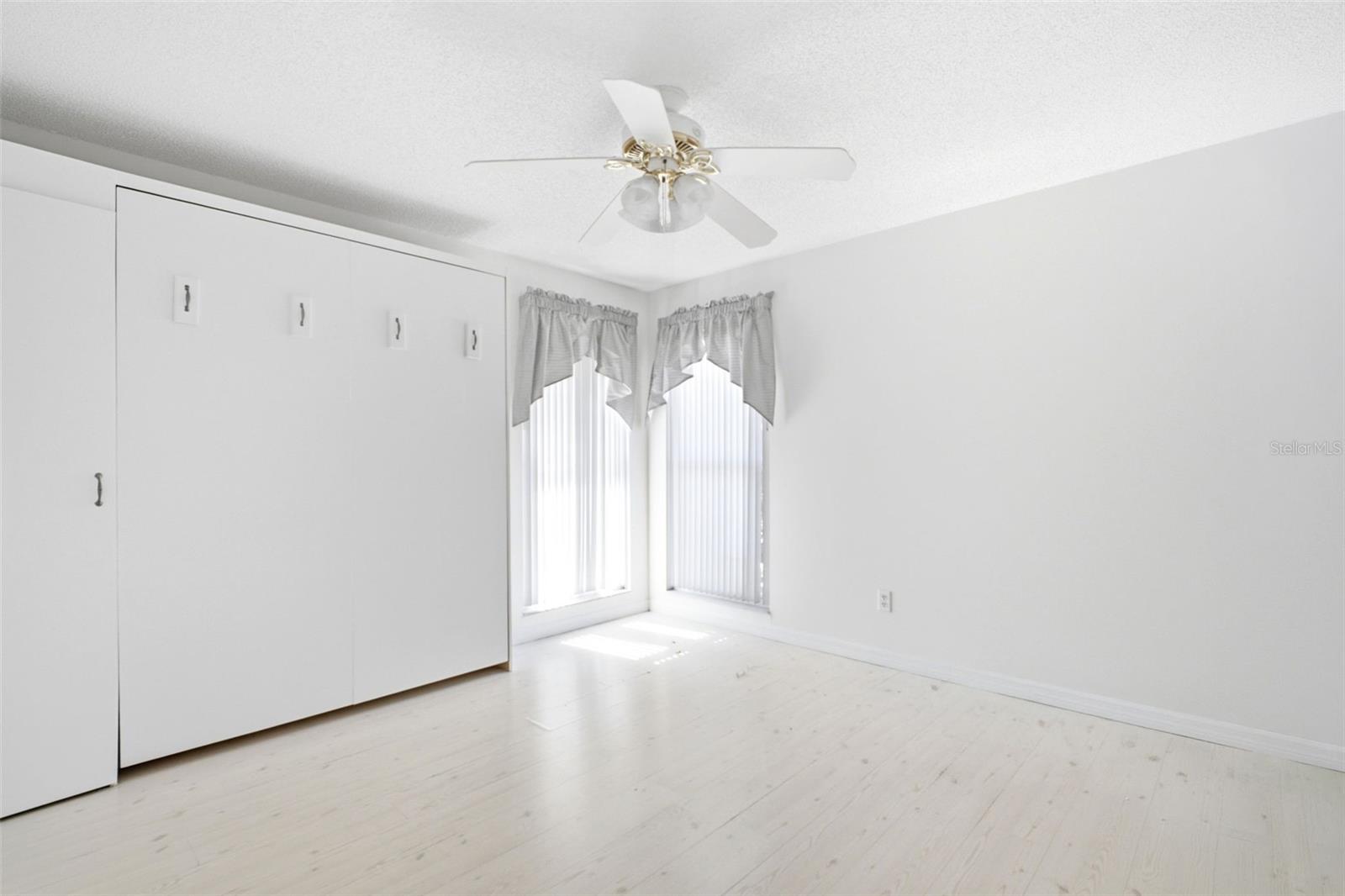 Guest suite offers a convenient murphy bead creating the perfect guest room or office space~