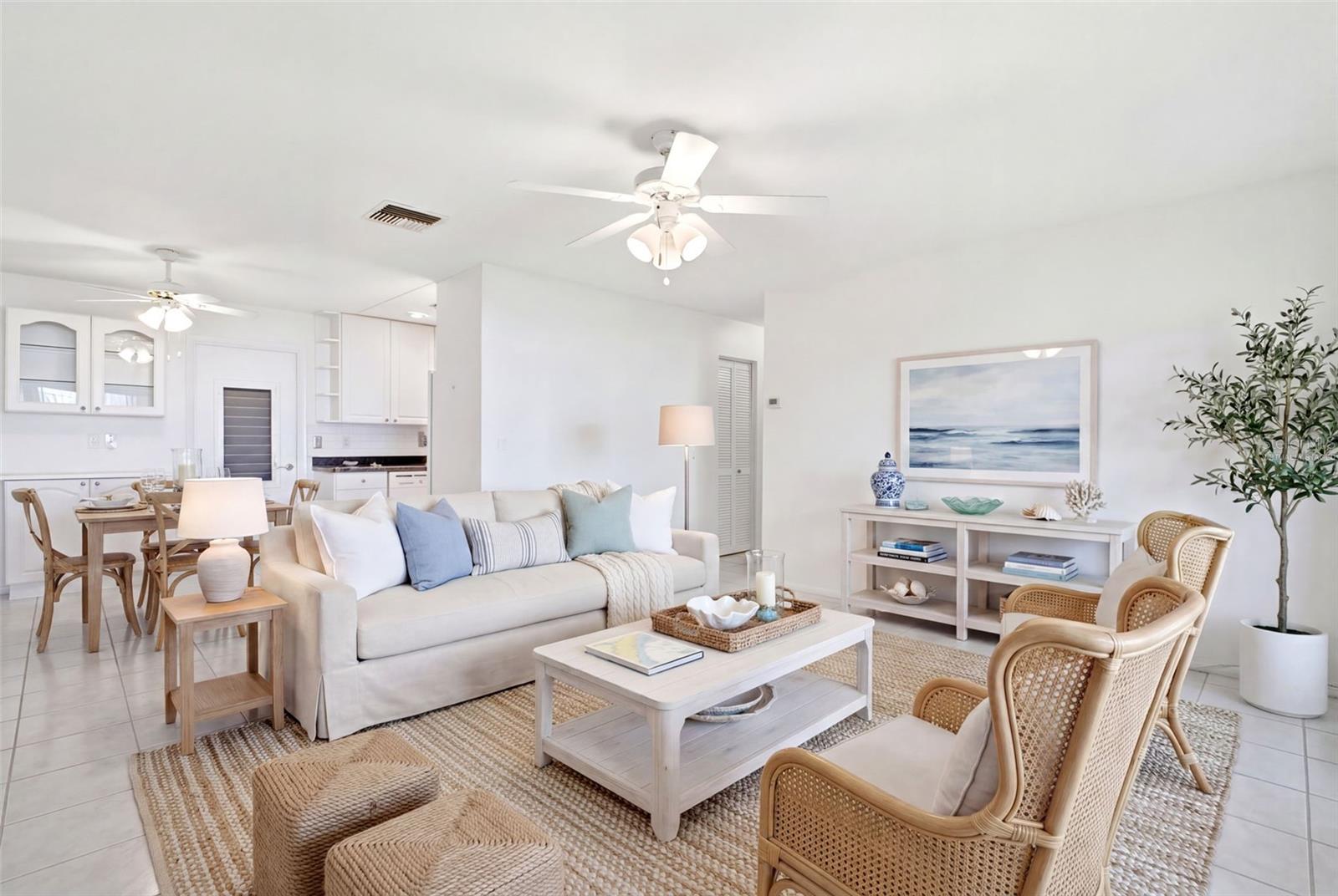 Virtually staged main living open to the dining room & kitchen~