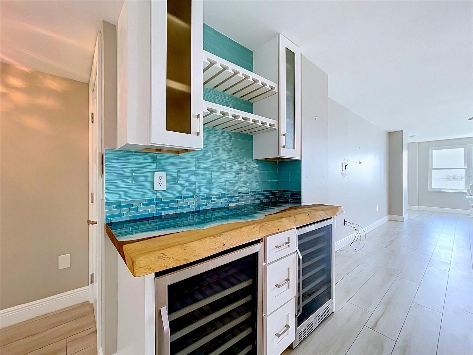 Custom bar with artistic beach countertop.