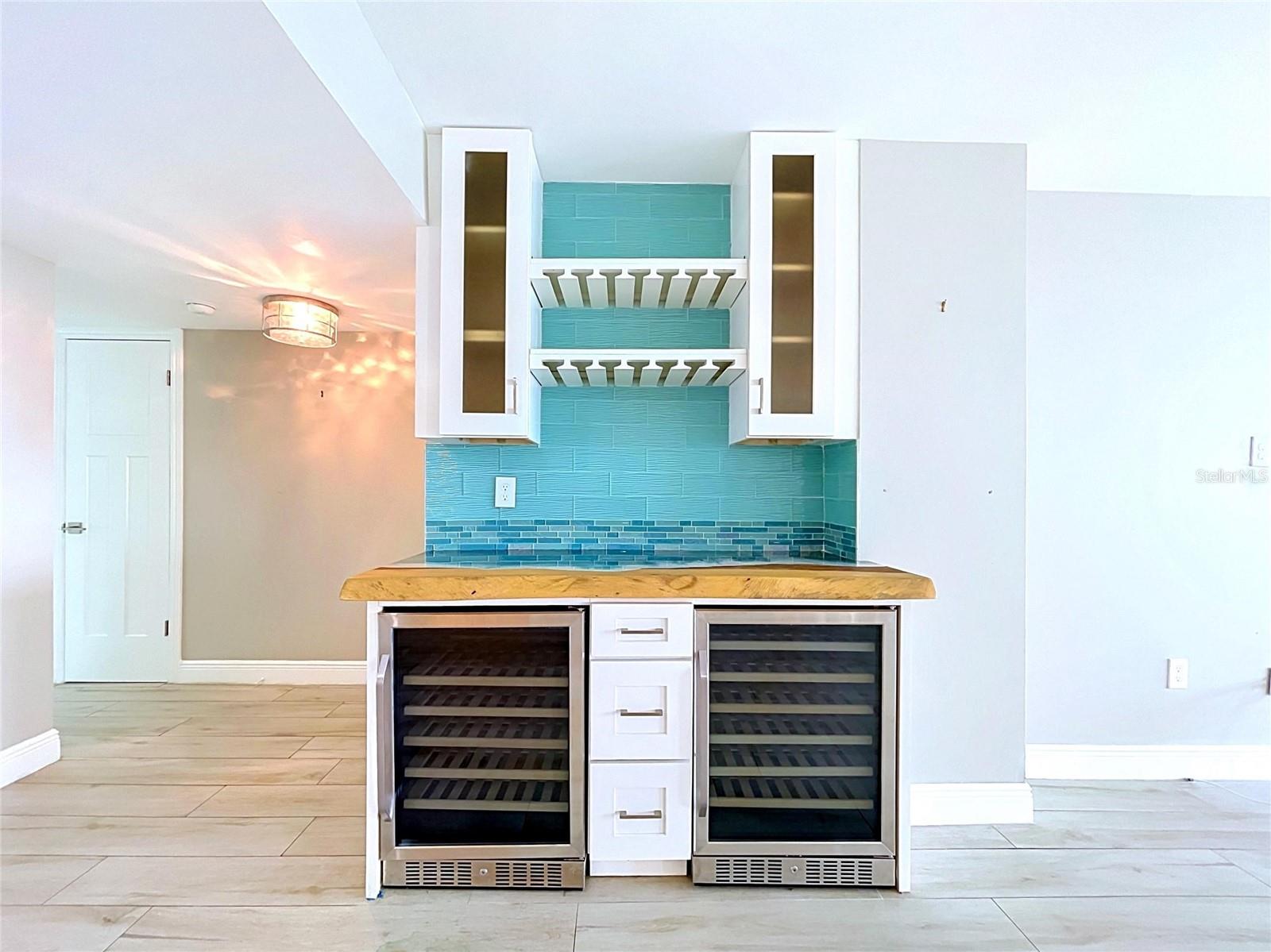 Custom bar with artistic beach countertop.