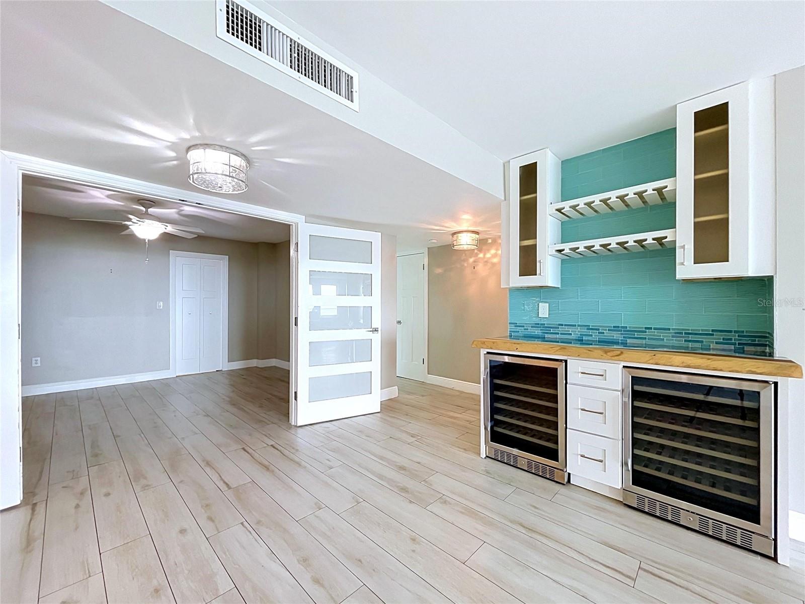 Custom bar with artistic beach countertop.