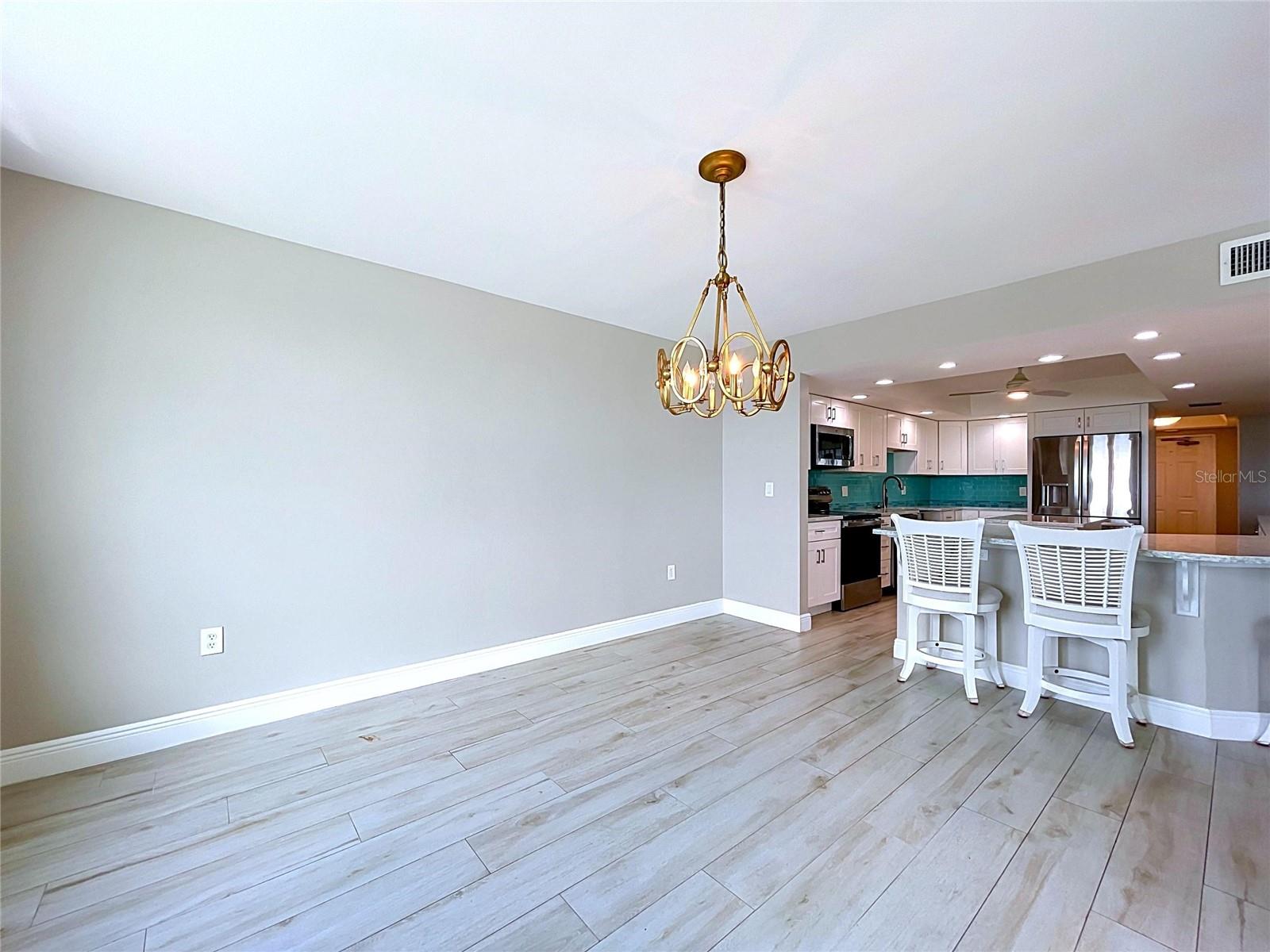 Spacious dining room with waterfront views.