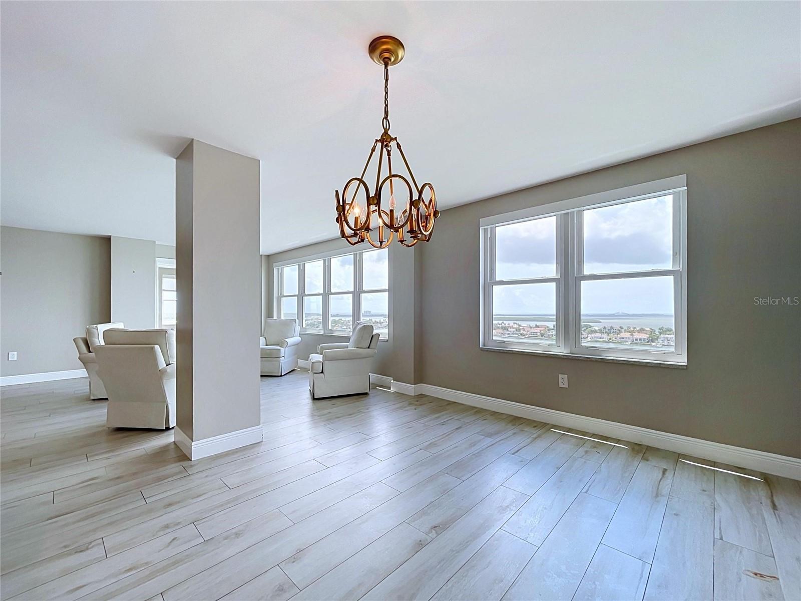 Spacious dining room with waterfront views.