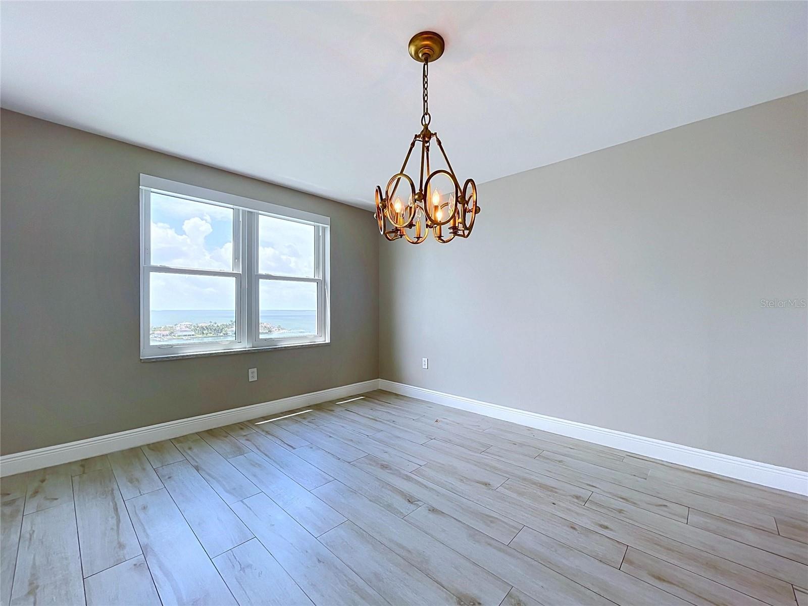 Spacious dining room with waterfront views.