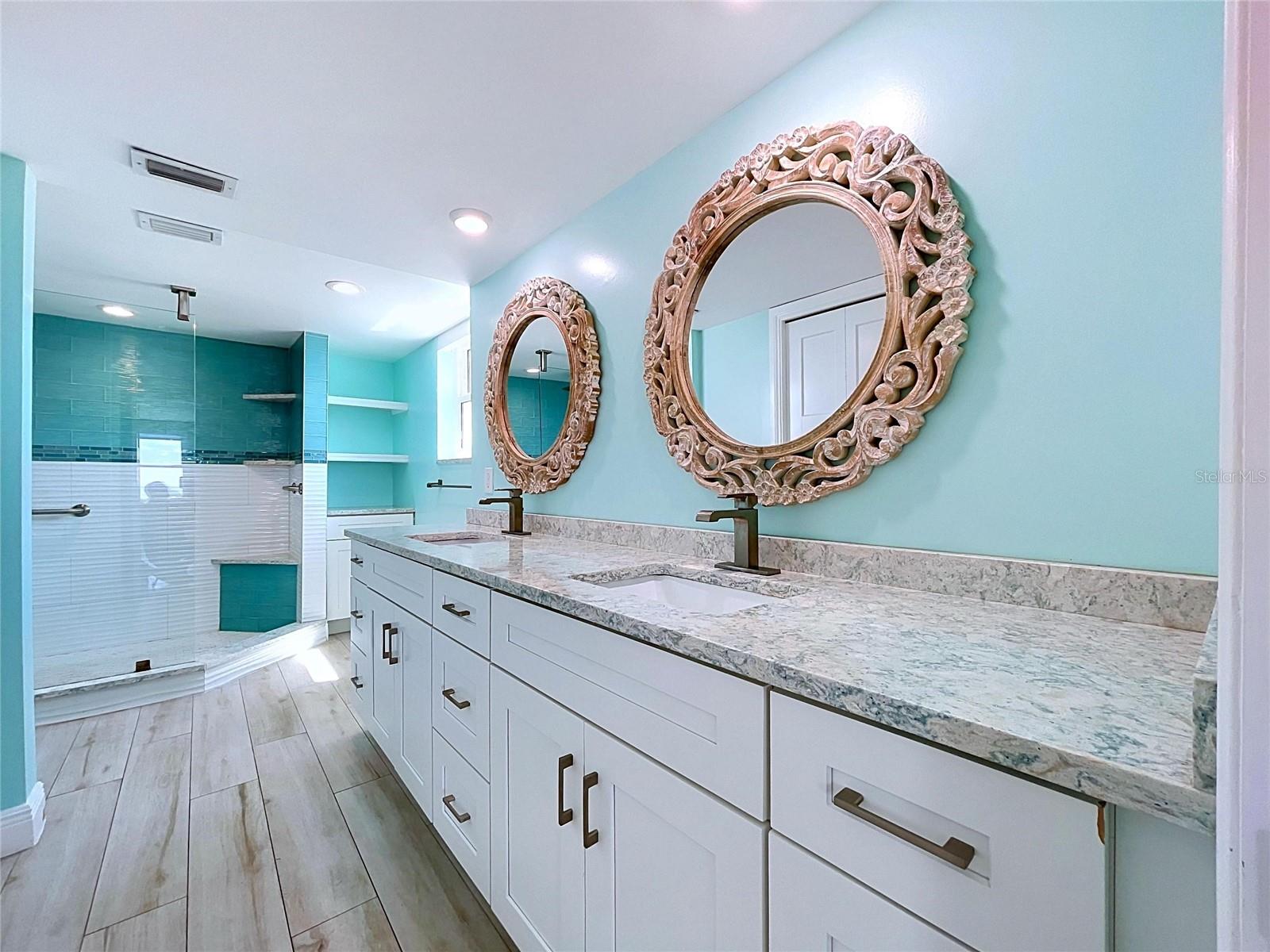 Custom and spetacular Primary bathroom with dual sinks and oversized walk-in shower.