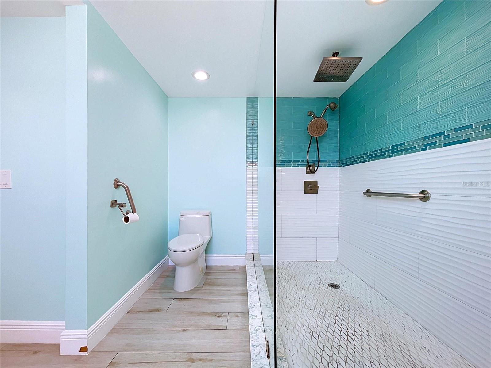 Custom and spetacular Primary bathroom with dual sinks and oversized walk-in shower.