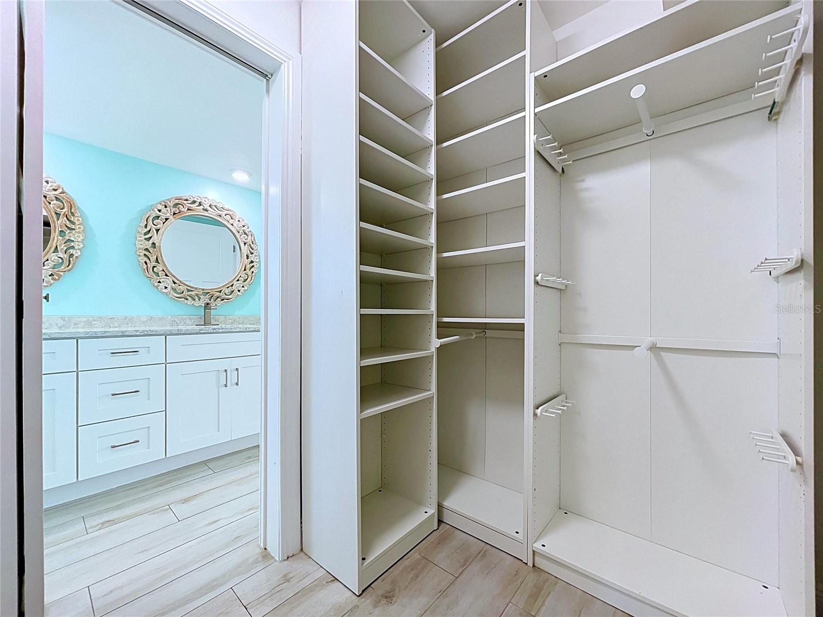 Large walk-in closets with built-in shelving.