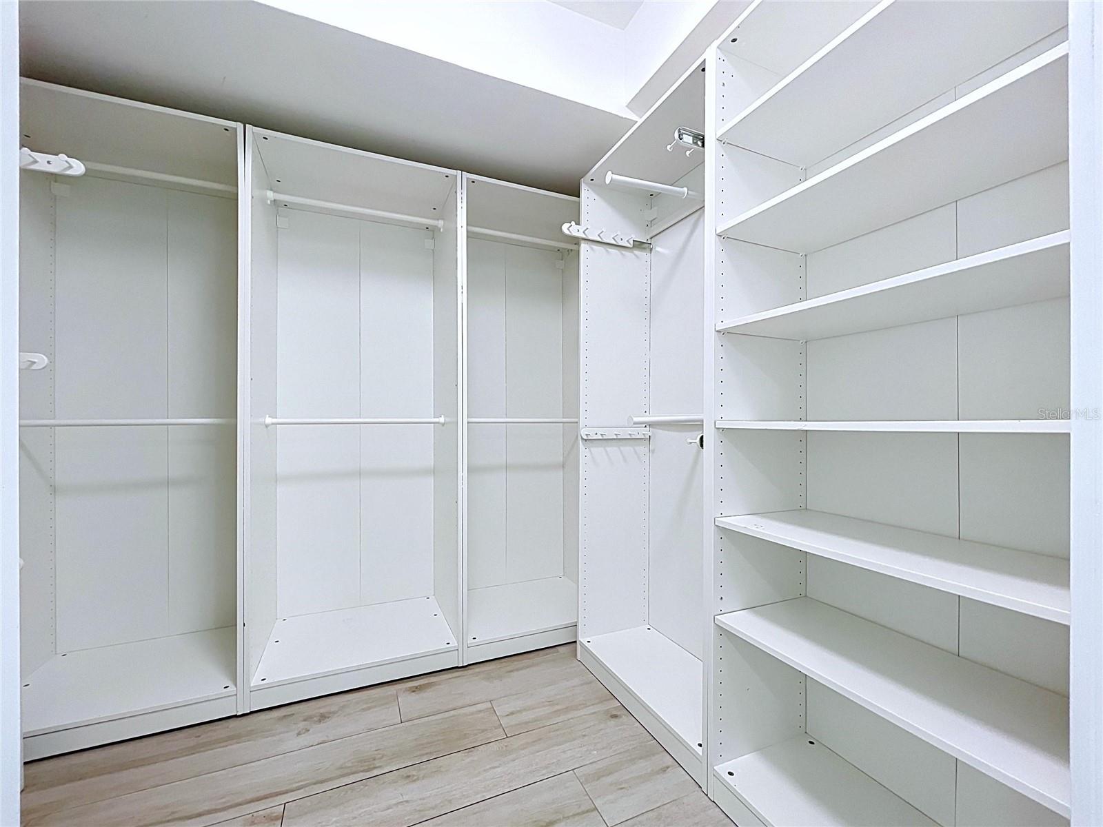 Large walk-in closets with built-in shelving.