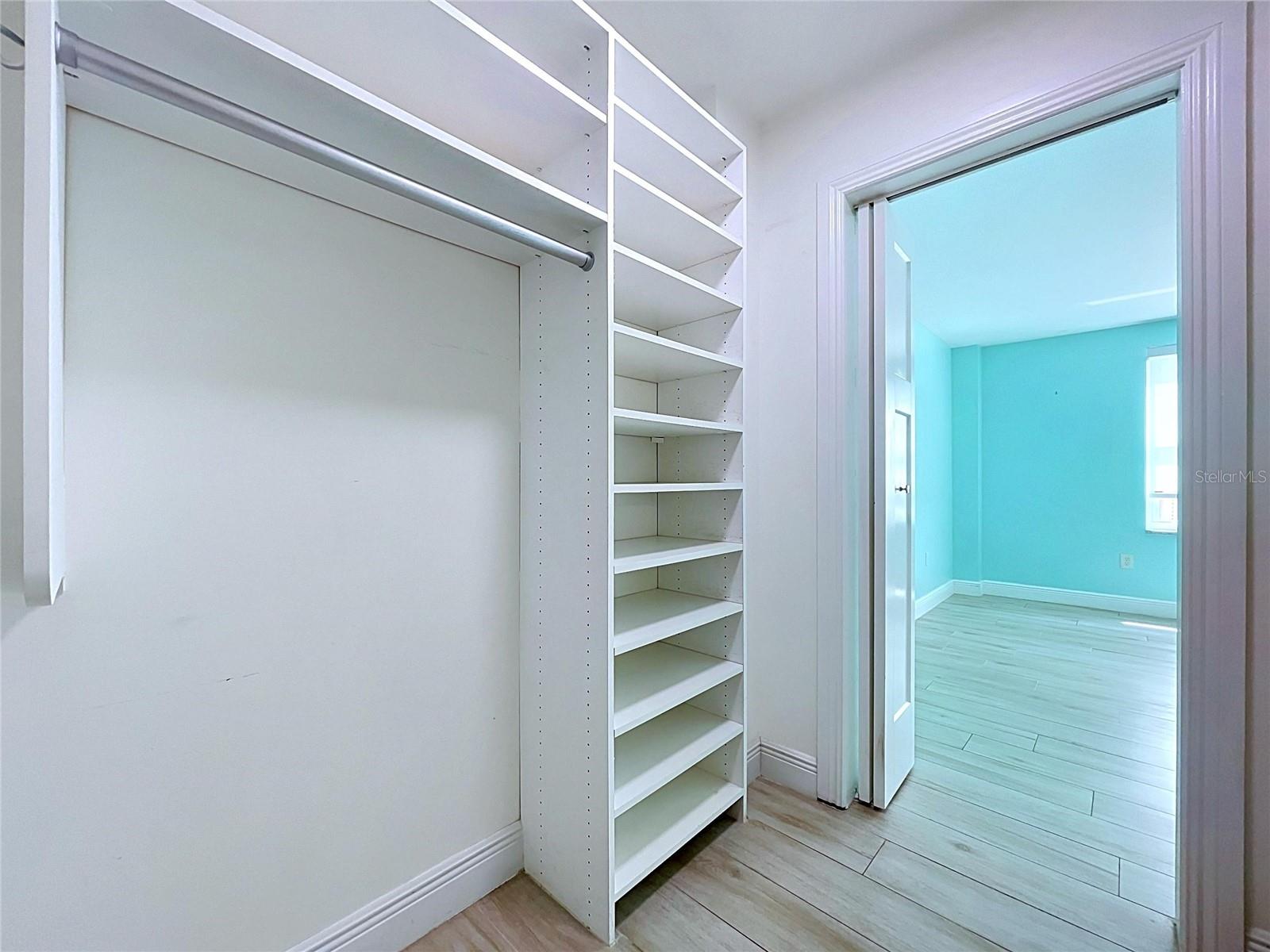 Large walk-in closets with built-in shelving.