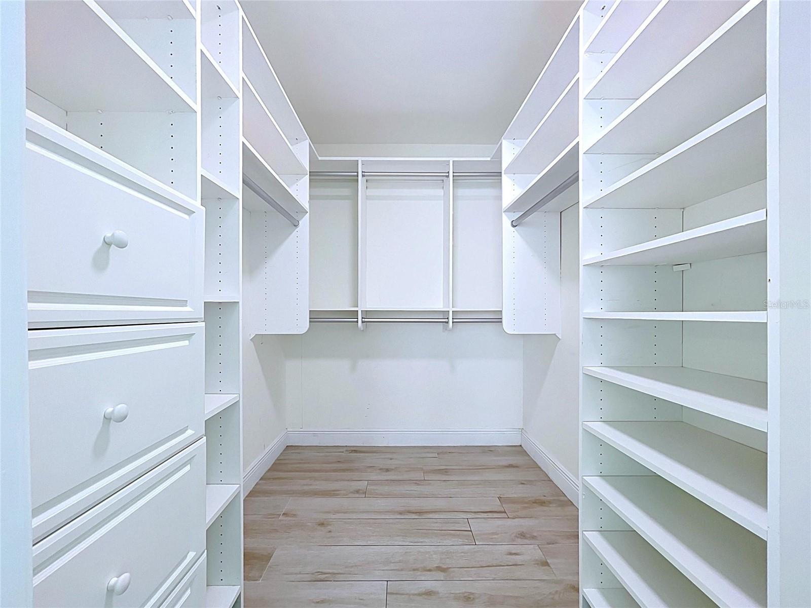 Large walk-in closets with built-in shelving.