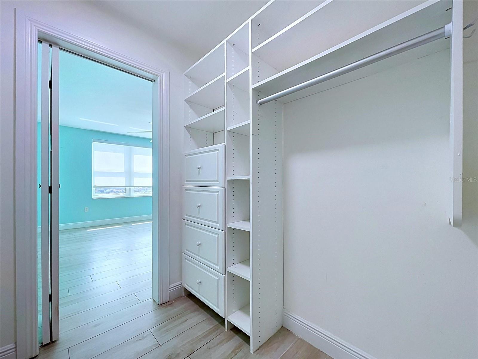 Large walk-in closets with built-in shelving.