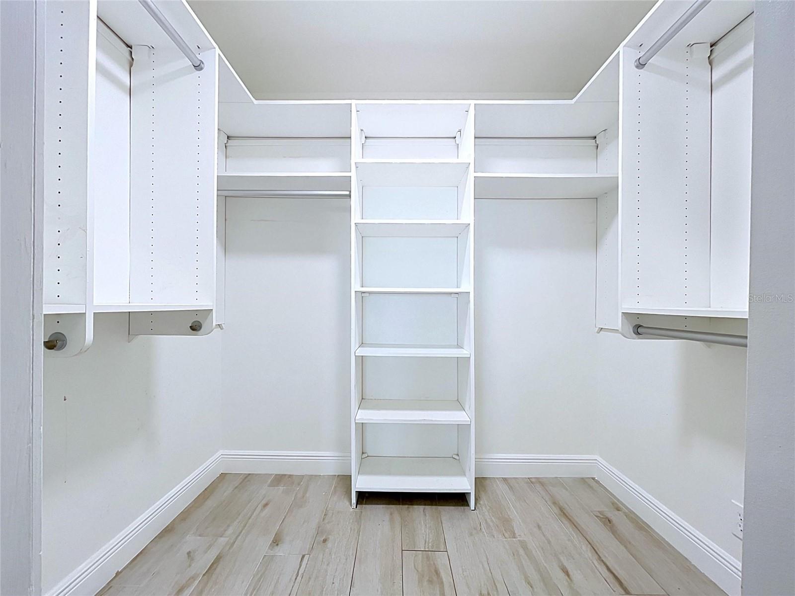 Large walk-in closets with built-in shelving.