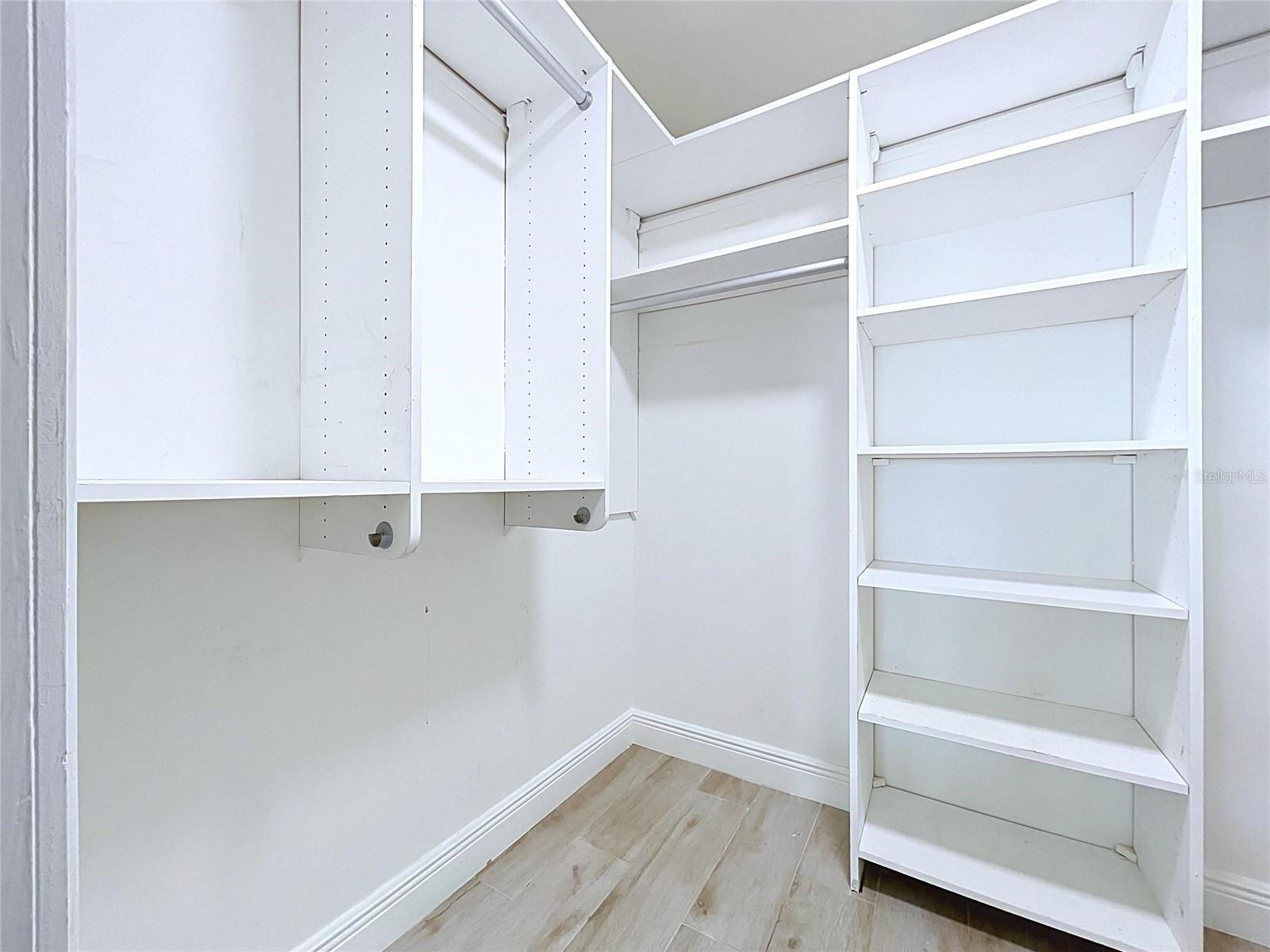 Large walk-in closets with built-in shelving.