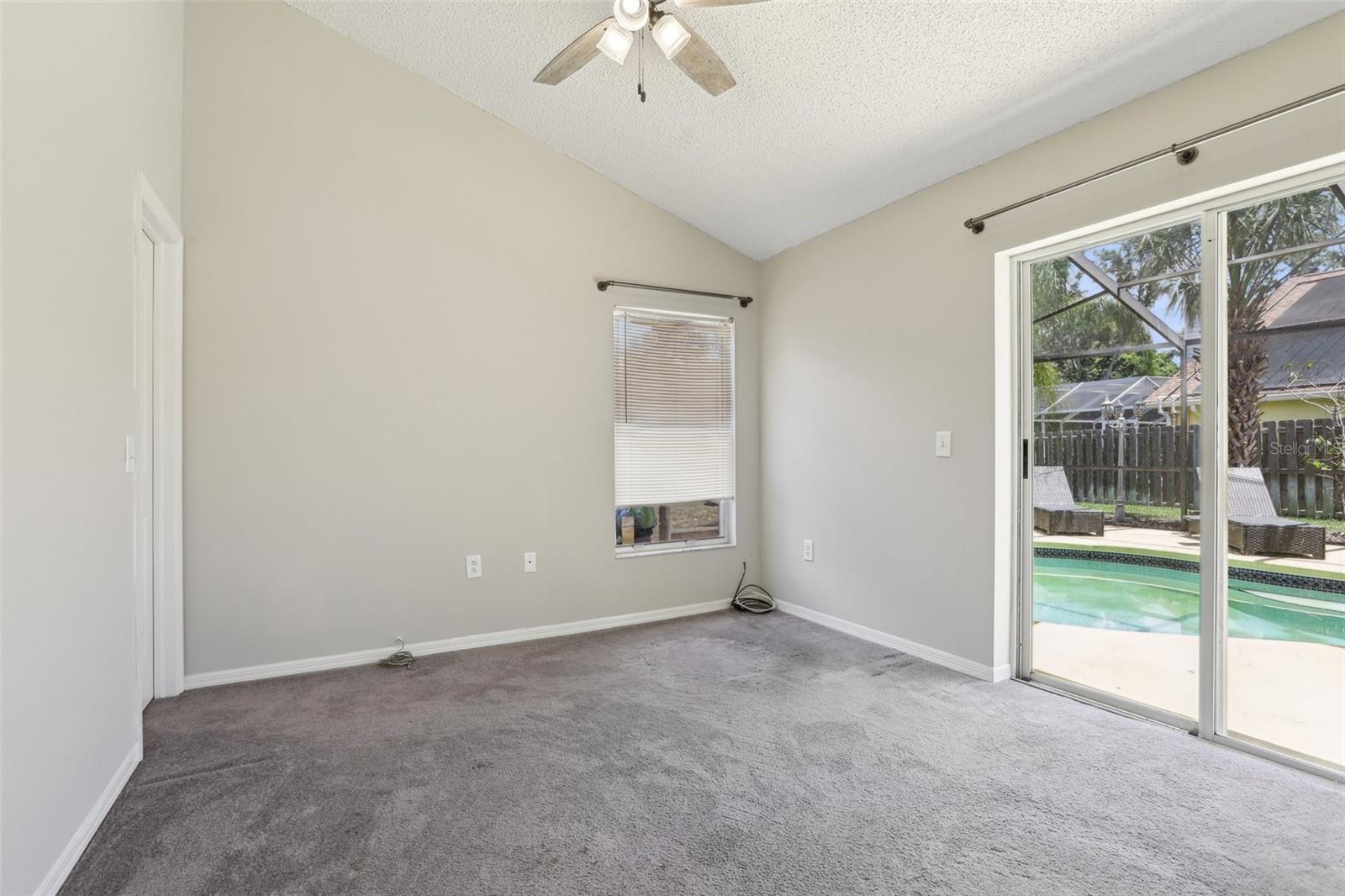 Bedroom 4 has access to the pool, conservation view and walk in closet.