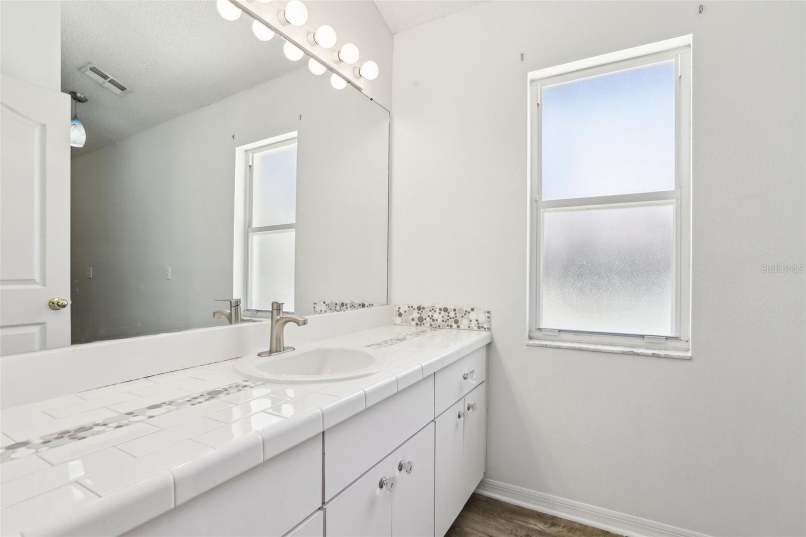 Guest bath with direct pool access.
