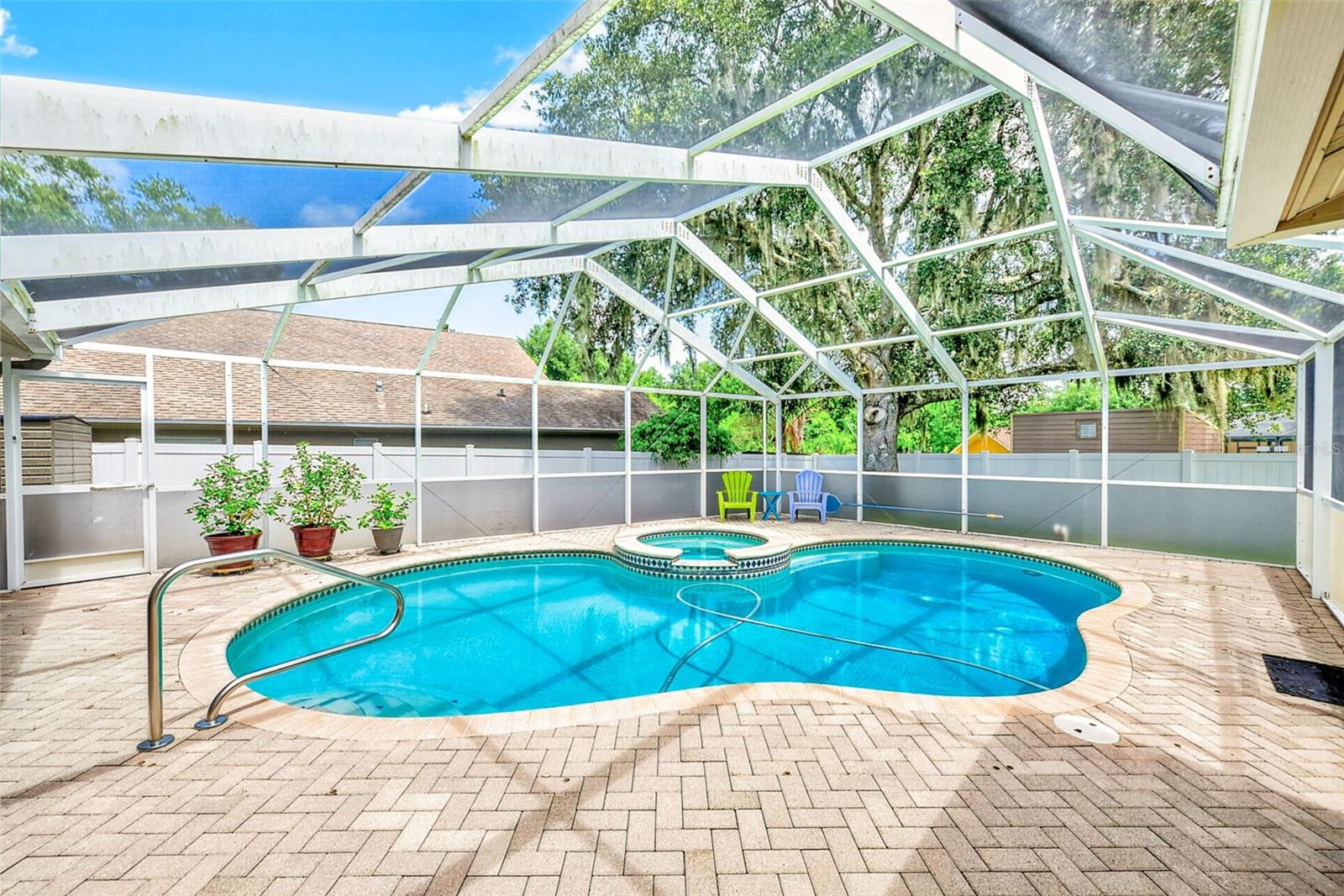 View of inground pool and spa
