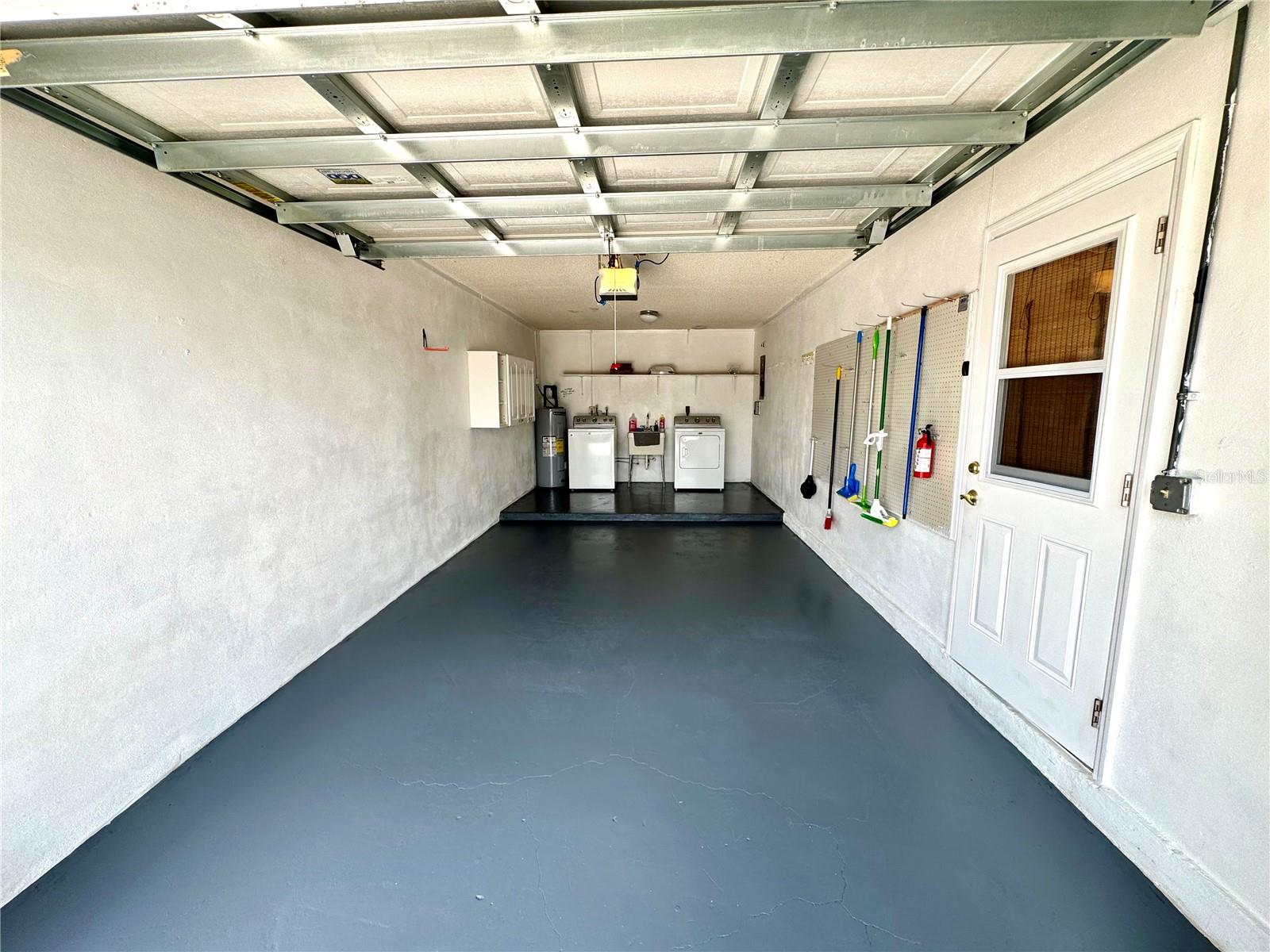Freshly painted garage with washer and dryer