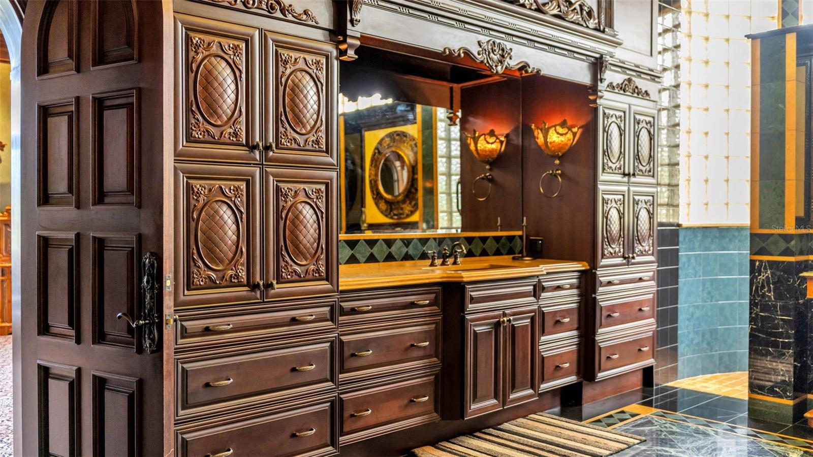 Custom Hardwood Doors & Cabinetry in Primary Bathroom, Curated custom  Lighting.