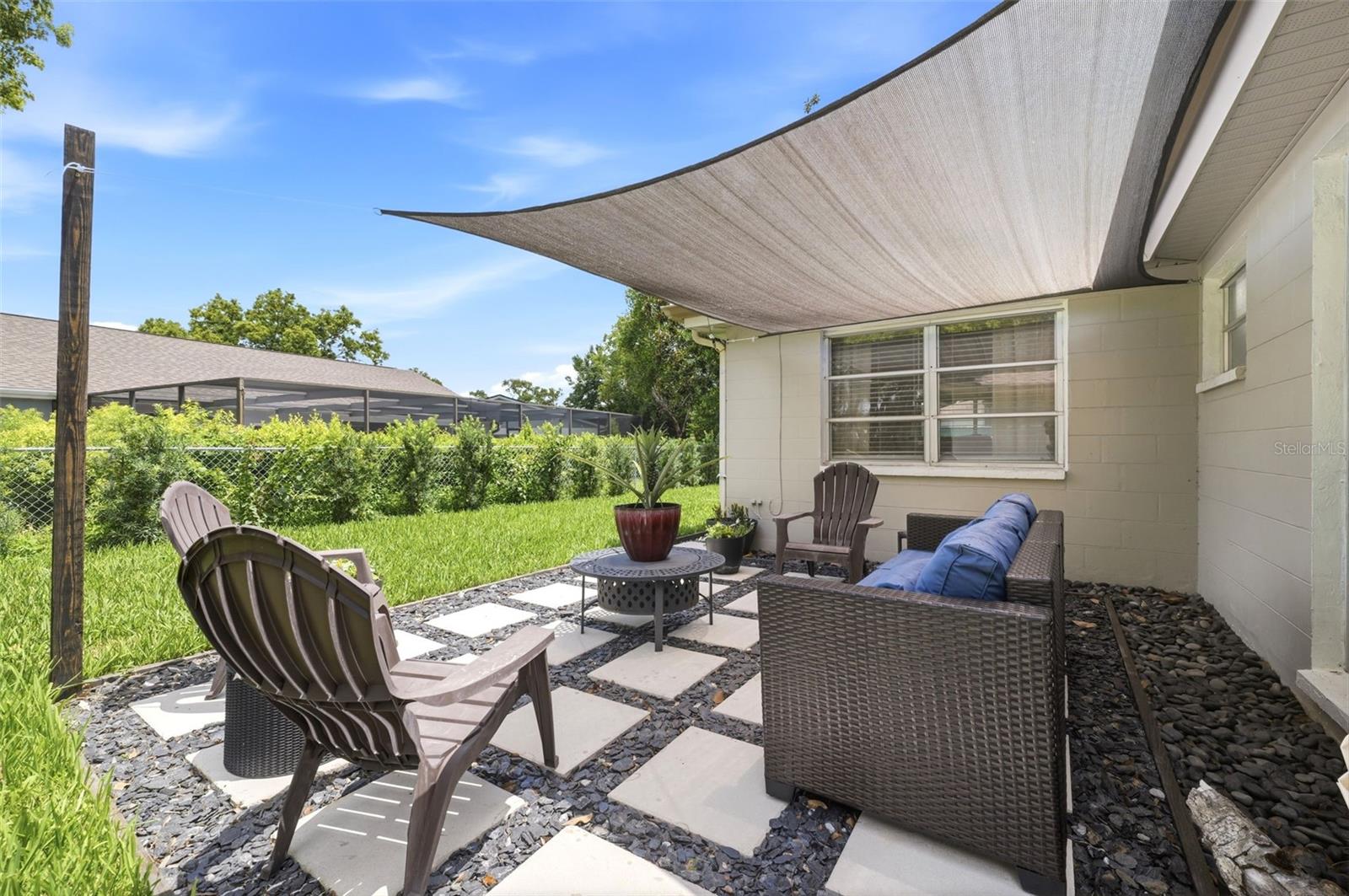 2025 added sun-shade, seating area and pavers