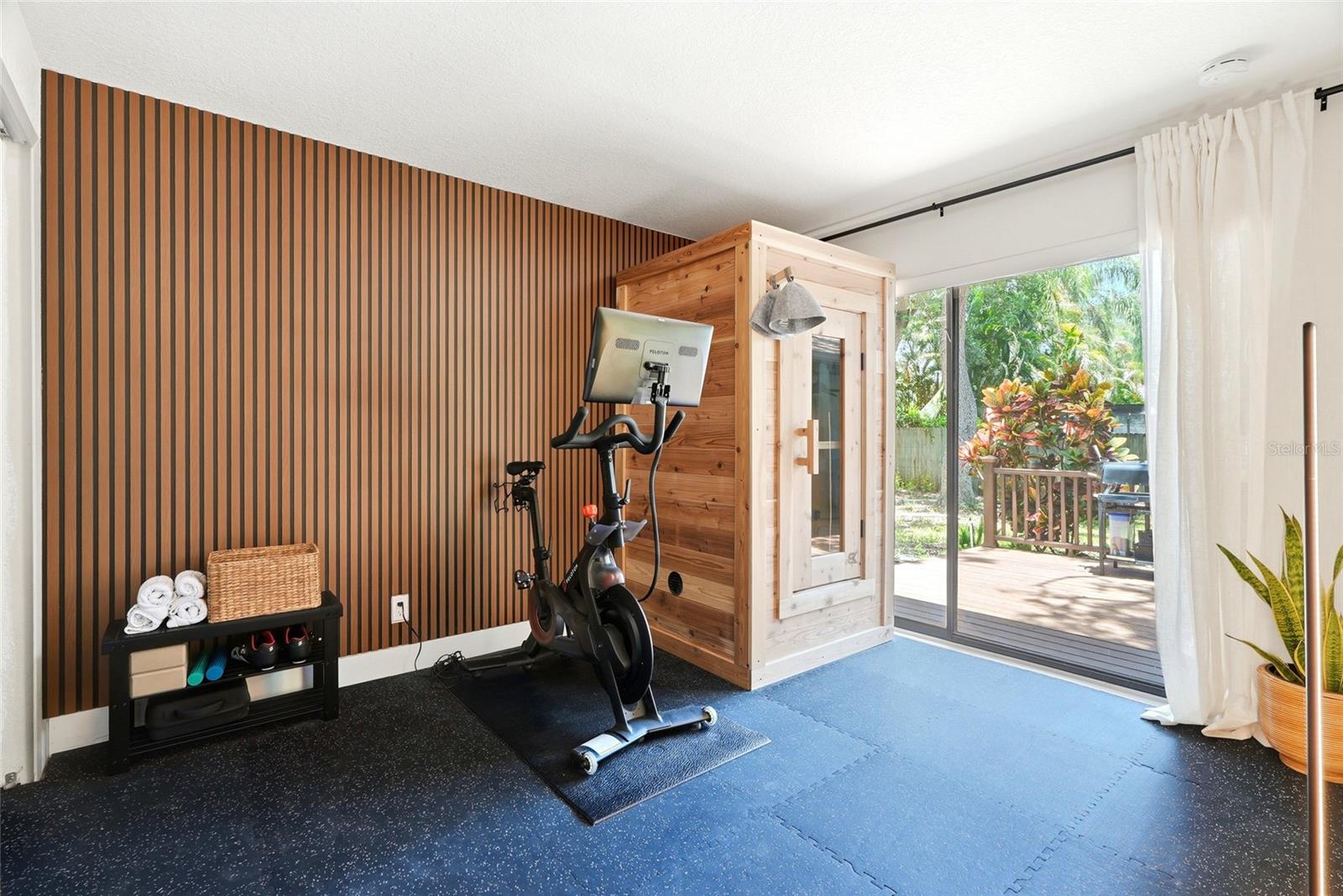 One of the Guest Bedrooms- Currently being used as home gym. Has the same flooring underneath their mats
