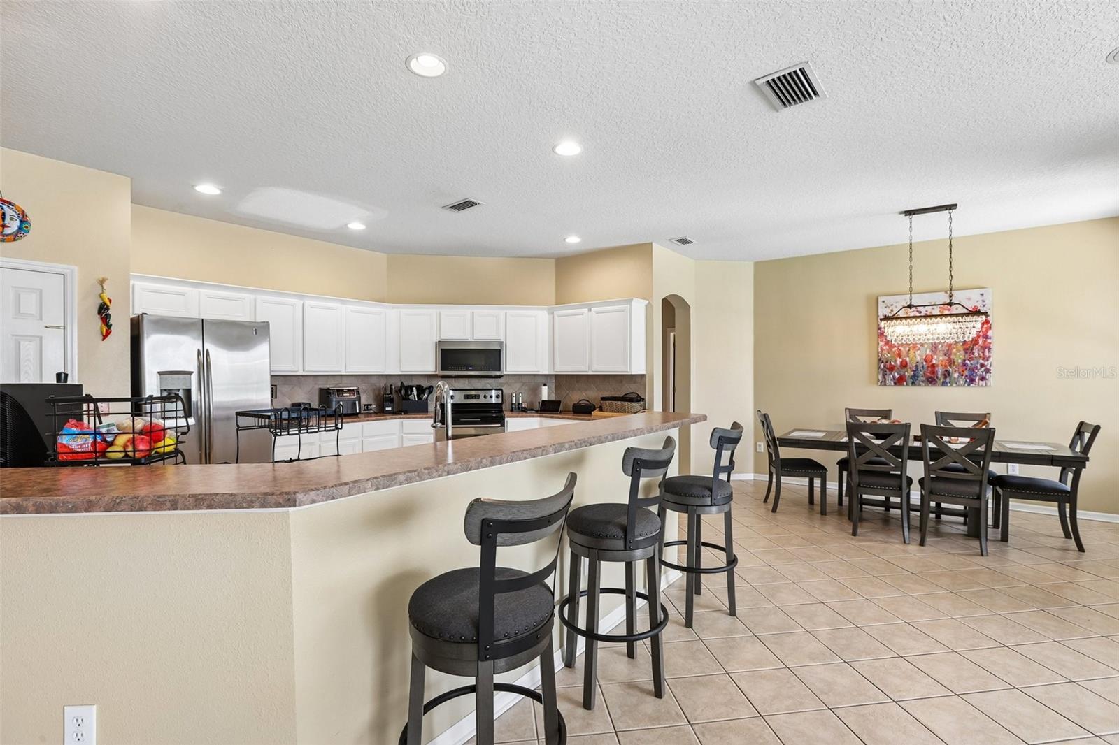 Kitchen Island and bar with view to Dining Room